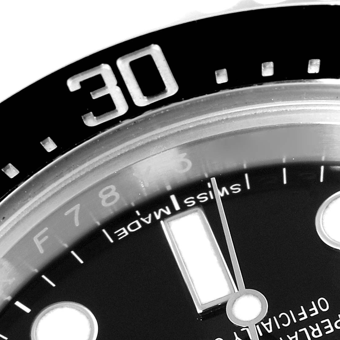 This close-up image shows the bezel, part of the dial, and the "Swiss Made" inscription of the Rolex Sea-Dweller 116600 Men's Stainless Steel Black Dial 116600 Men's Stainless Steel Black Dial watch.