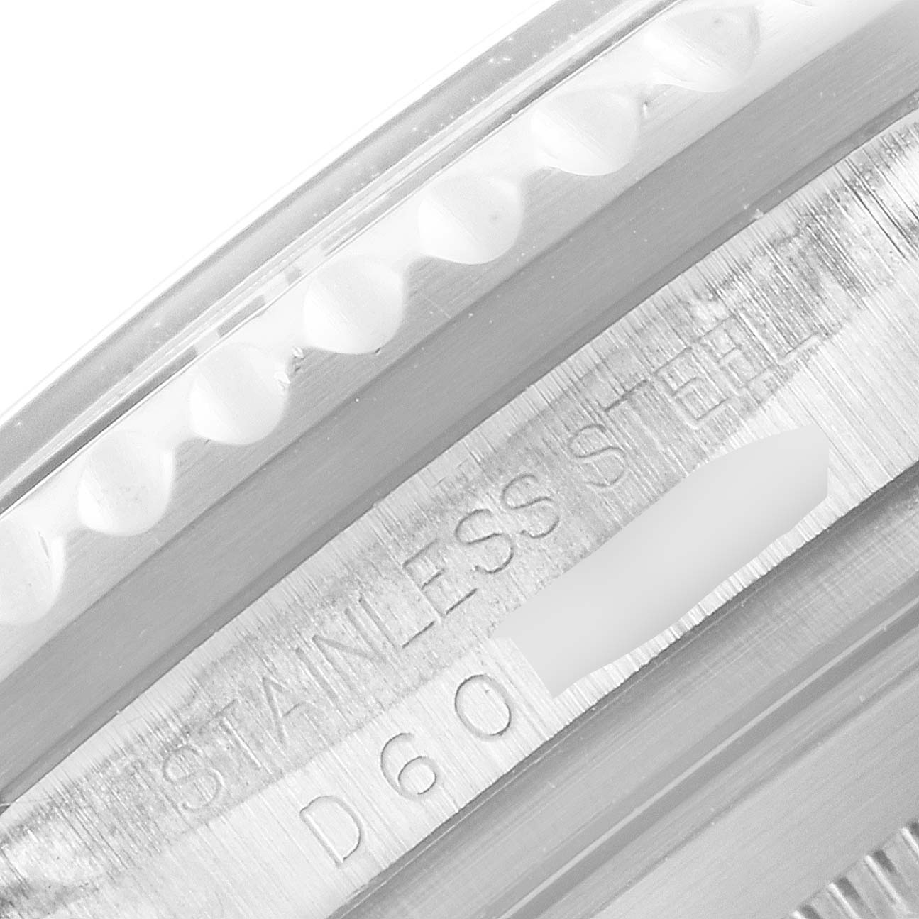 The image shows a close-up of the bezel and the engraved case back of the Rolex Sea-Dweller 16600 Men
s Stainless Steel Black Dial 16600 Men
s Stainless Steel Black Dial model.