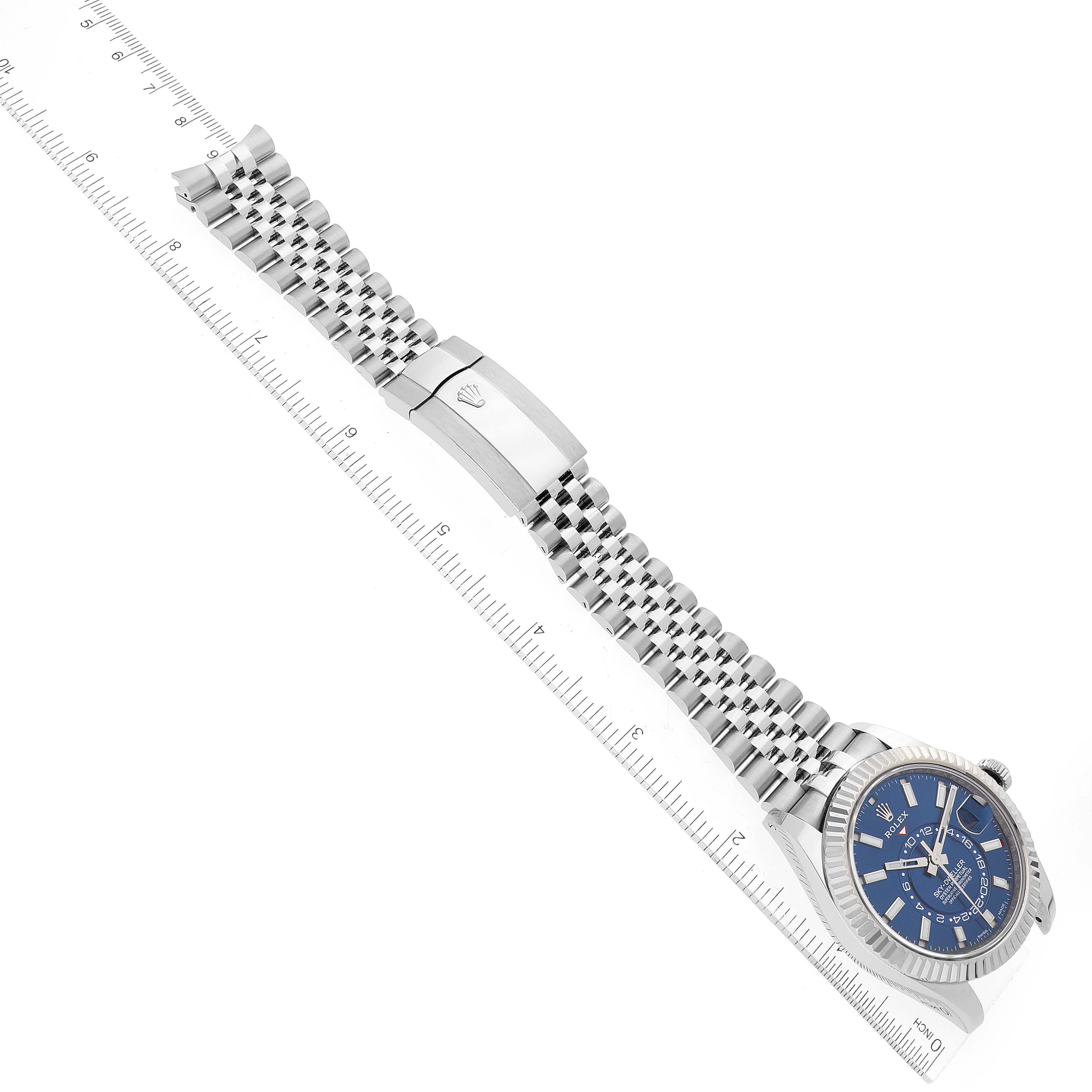 The image shows a top-down view of a Rolex Sky-Dweller 326934 Men's Stainless Steel Blue Dial 326934 Men's Stainless Steel Blue Dial watch, highlighting its blue dial, bezel, and metal bracelet with the clasp visible.