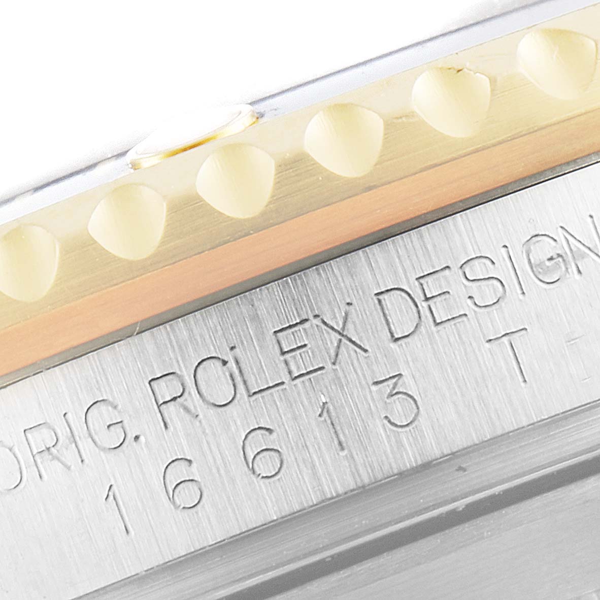 The image shows a close-up of the bezel and case with model engraving on the Rolex Submariner 16613 Men
s Steel and Gold (two tone) Blue Dial 16613 Men
s Steel and Gold (two tone) Blue Dial watch.