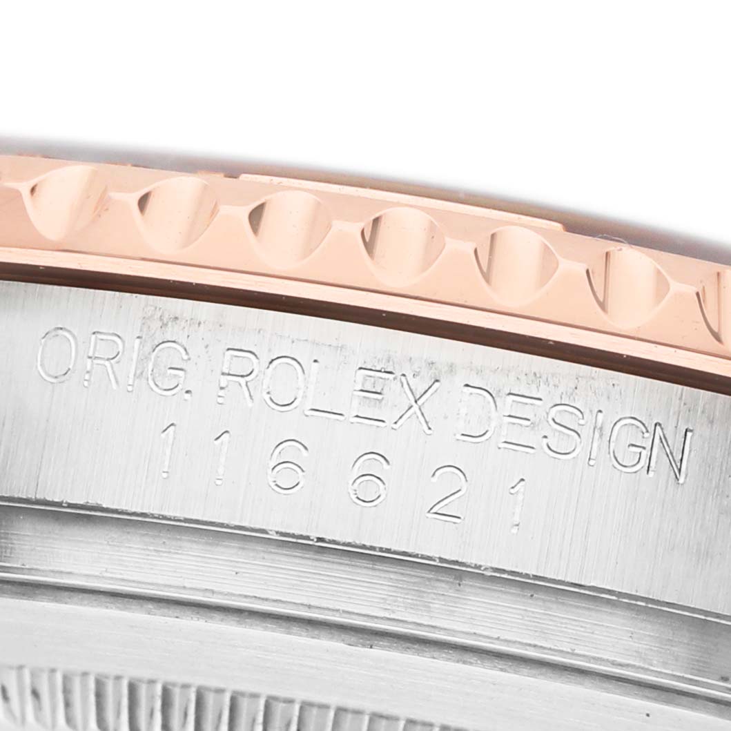 The image shows a close-up of the Rolex Yacht-Master 116621 Men's Steel and Gold (two tone) Black Dial's bezel and engraved case, highlighting the model number.