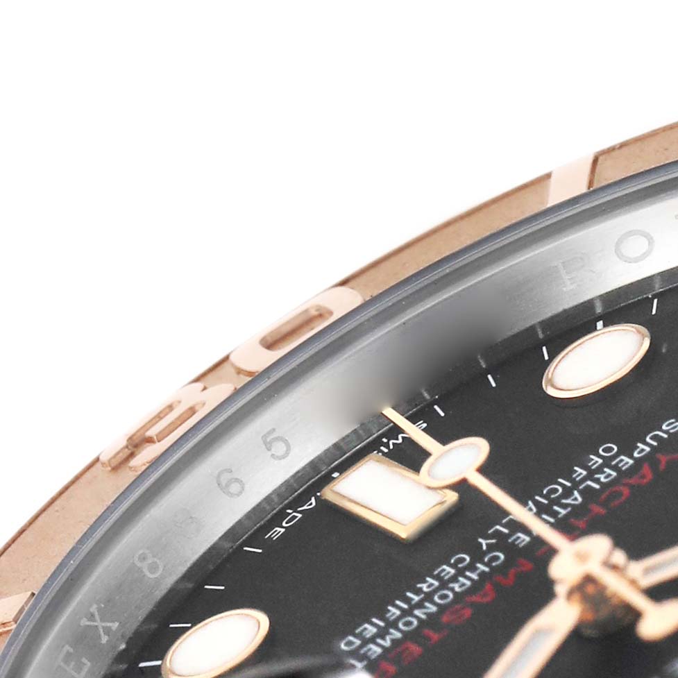 The image shows a close-up of the dial and bezel of a Rolex Yacht-Master 116621 Men's Steel and Gold (two tone) Black Dial watch.
