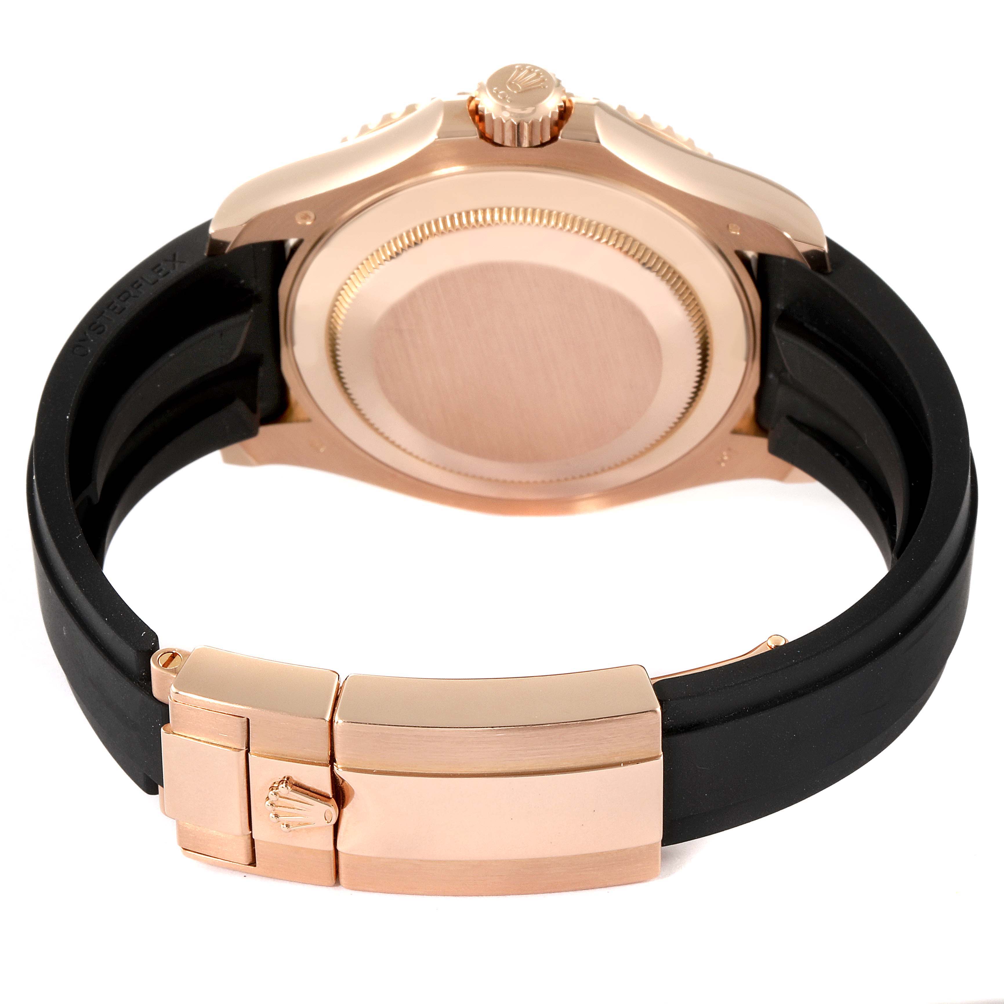 The image shows the back and clasp of a Rolex Yacht-Master 116655 Men
s Rose Gold Black Dial 116655 Men
s Rose Gold Black Dial watch with a black strap and gold case.