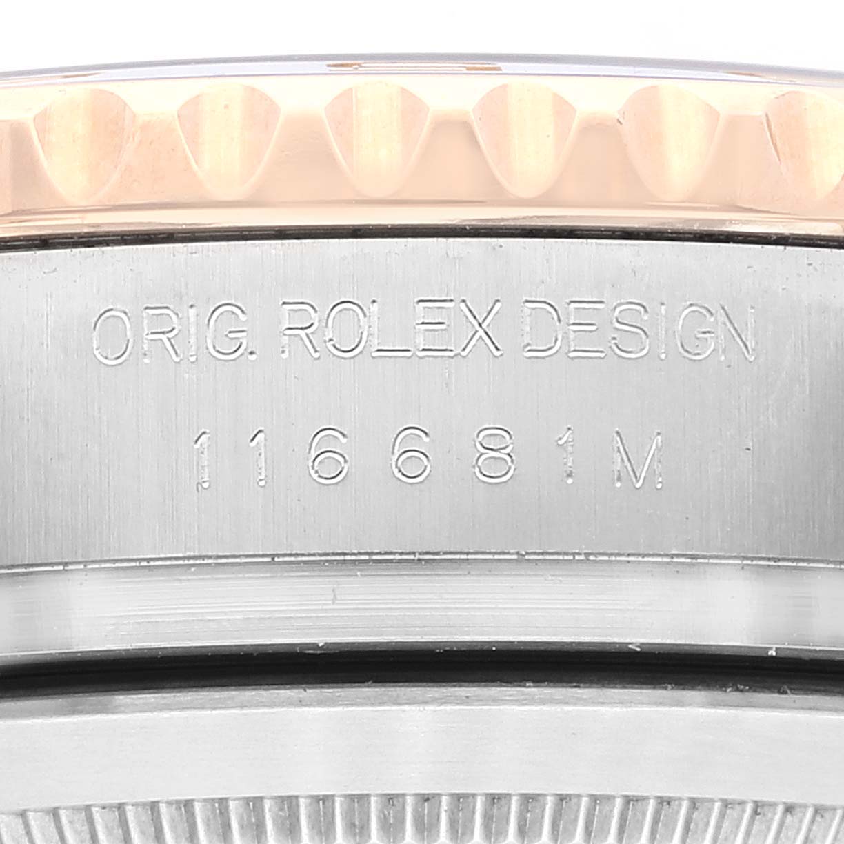This close-up image shows the side engraving of a Rolex Yacht-Master 116681 Men's Steel and Gold (two tone) White Dial 116681 Men's Steel and Gold (two tone) White Dial model, including its model number and design details.
