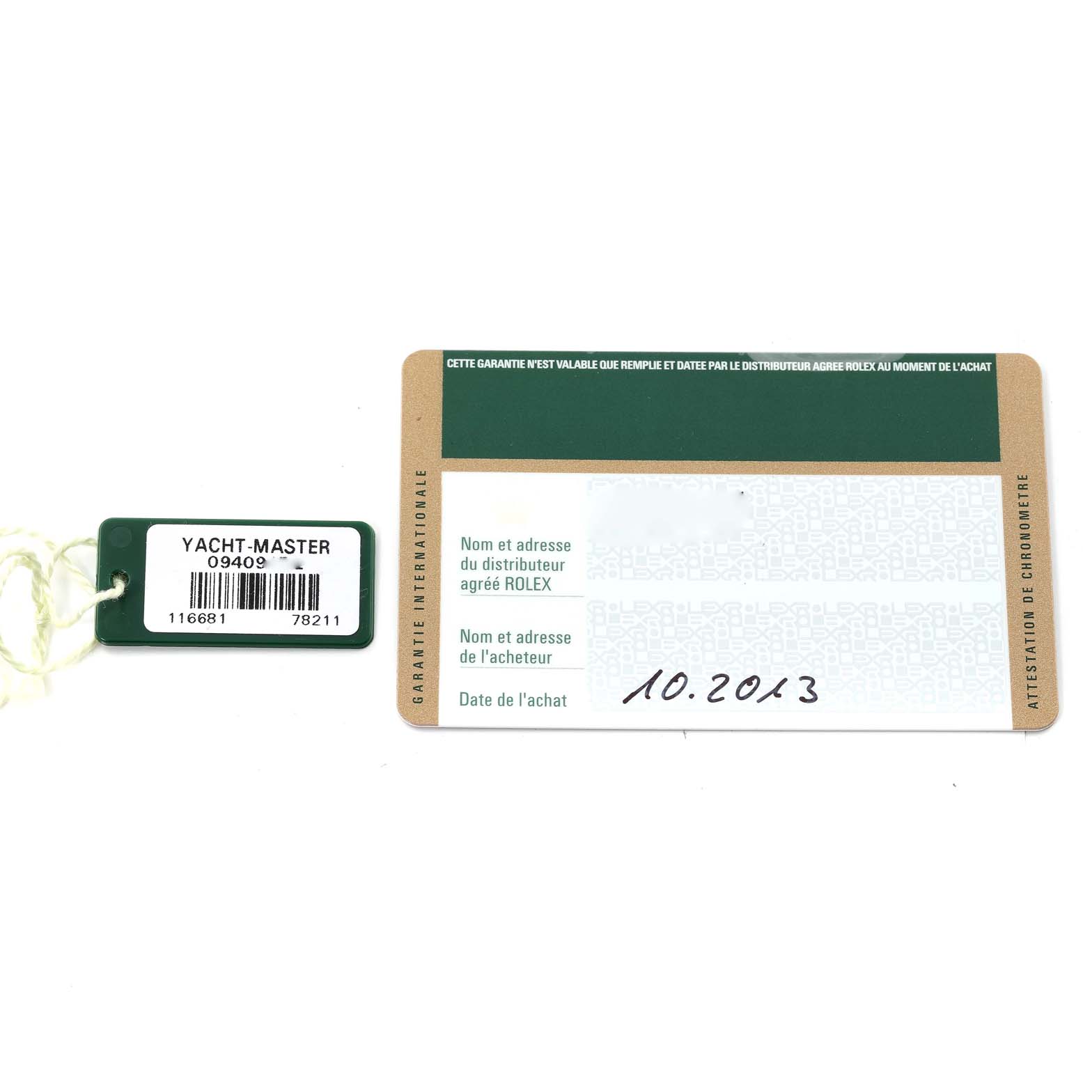 The image shows the serial tag and warranty card for a Rolex Yacht-Master 116681 Men's Steel and Gold (two tone) White Dial 116681 Men's Steel and Gold (two tone) White Dial watch, placed flat.