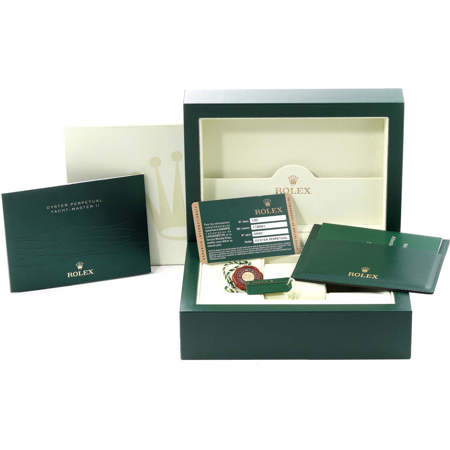 This image shows the packaging and documents for a Rolex Yacht-Master 116681 Men's Steel and Gold (two tone) White Dial 116681 Men's Steel and Gold (two tone) White Dial watch, including the box, manuals, warranty card, and tags.