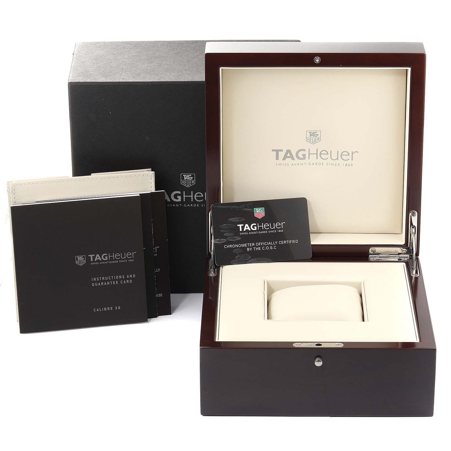 The image shows the packaging and accessories of a Tag Heuer Carrera CAV5185.FC6237 Men's Titanium Black Dial CAV5185.FC6237 Men's Titanium Black Dial watch, including the box, manuals, and certification card.