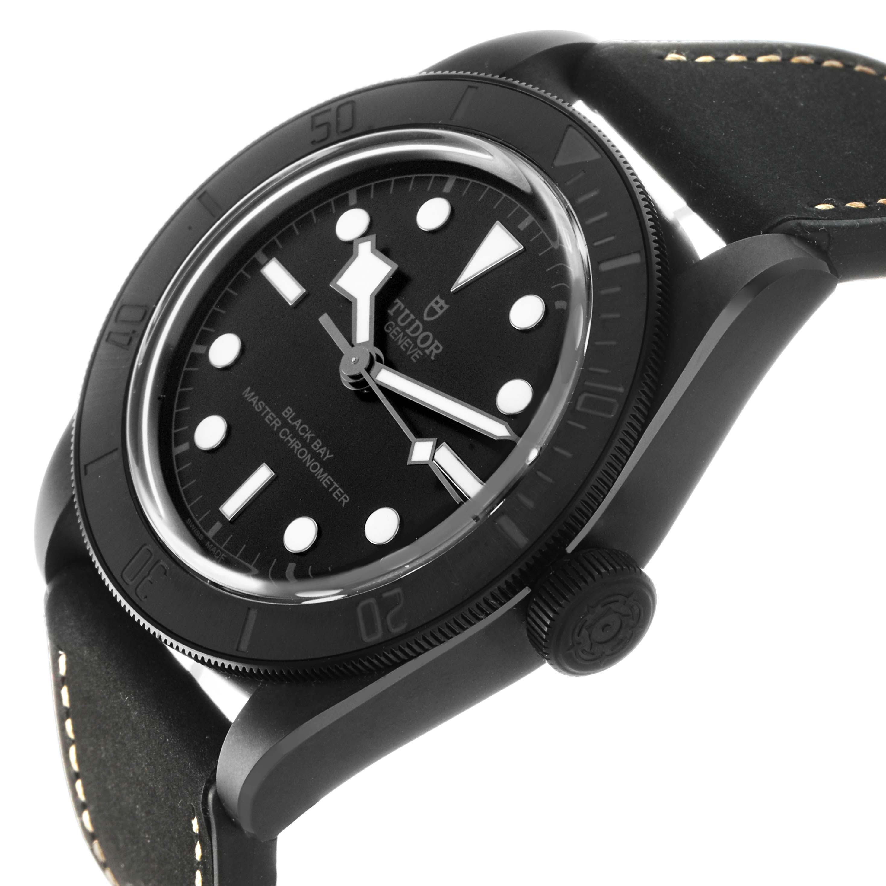 The Tudor Heritage Black Bay 79210 Men's Ceramic Black Dial watch is shown at a slight side angle, highlighting the dial, bezel, crown, and part of the black strap.