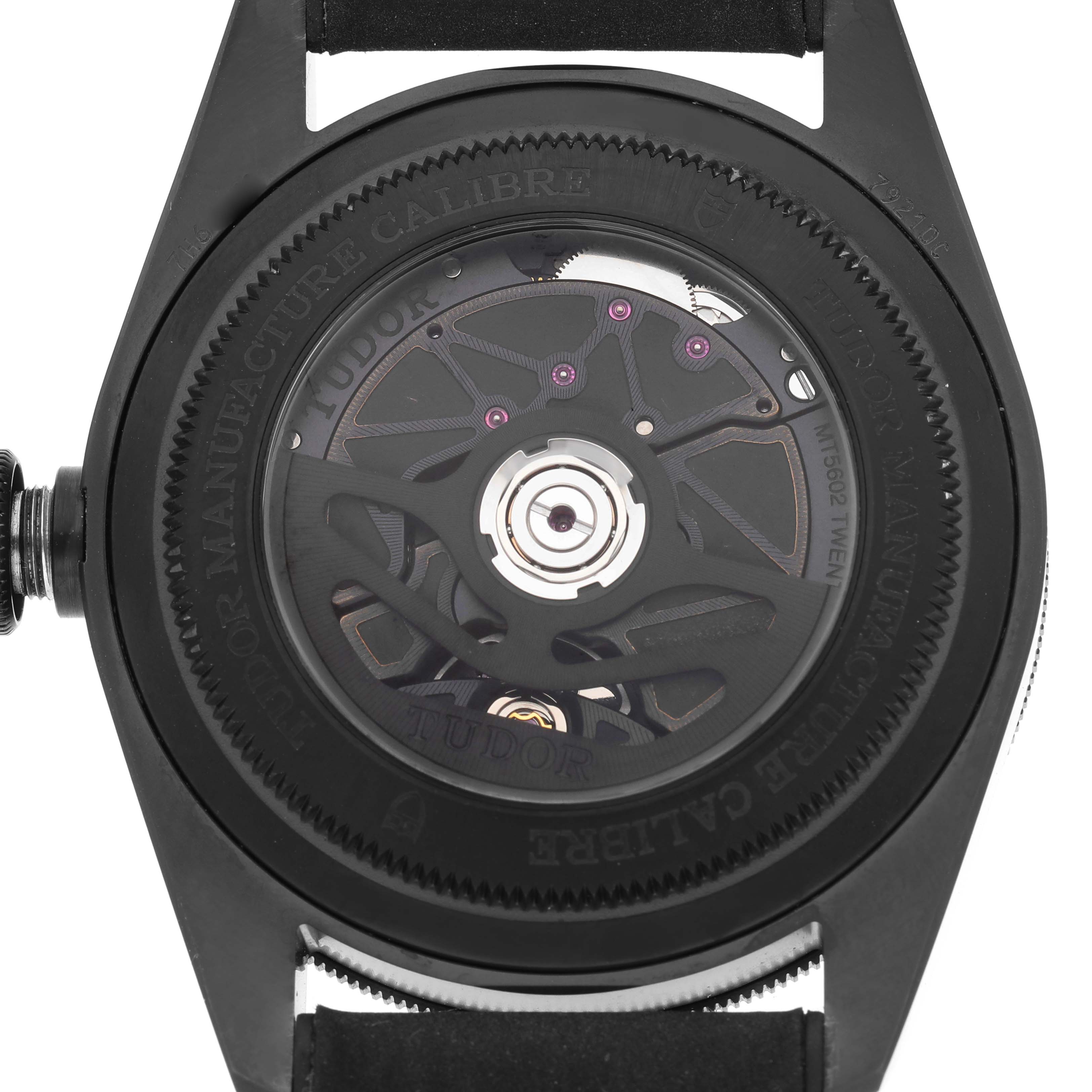 The image shows the case back of a Tudor Heritage Black Bay 79210 Men's Ceramic Black Dial watch, highlighting the movement.