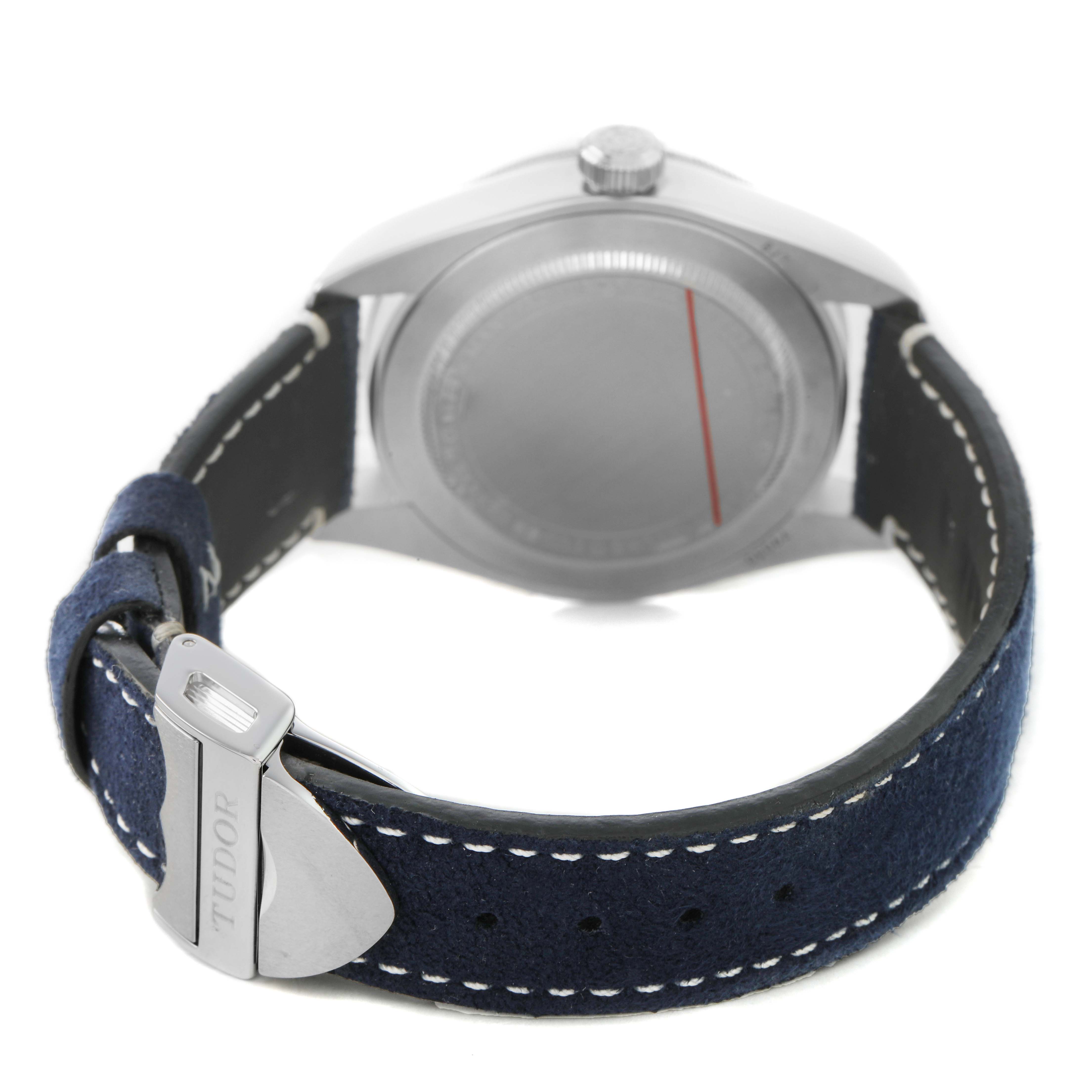 The image shows the back of a Tudor Heritage Black Bay 79030 Men's Stainless Steel Blue Dial watch, highlighting the caseback, crown, and clasp of the strap.