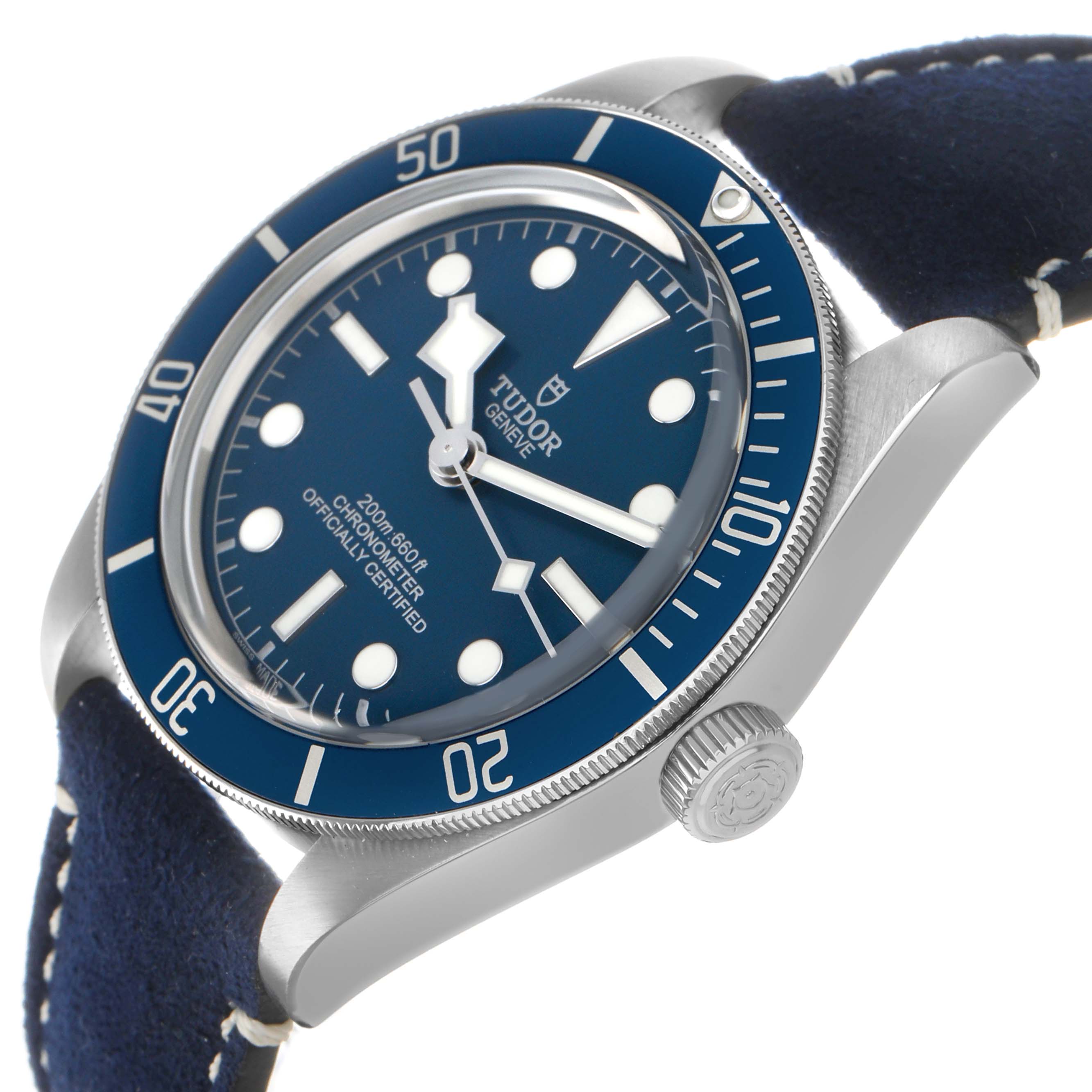 The Tudor Heritage Black Bay 79030 Men's Stainless Steel Blue Dial watch is shown at an angled side view, highlighting its blue bezel, dial, and crown.