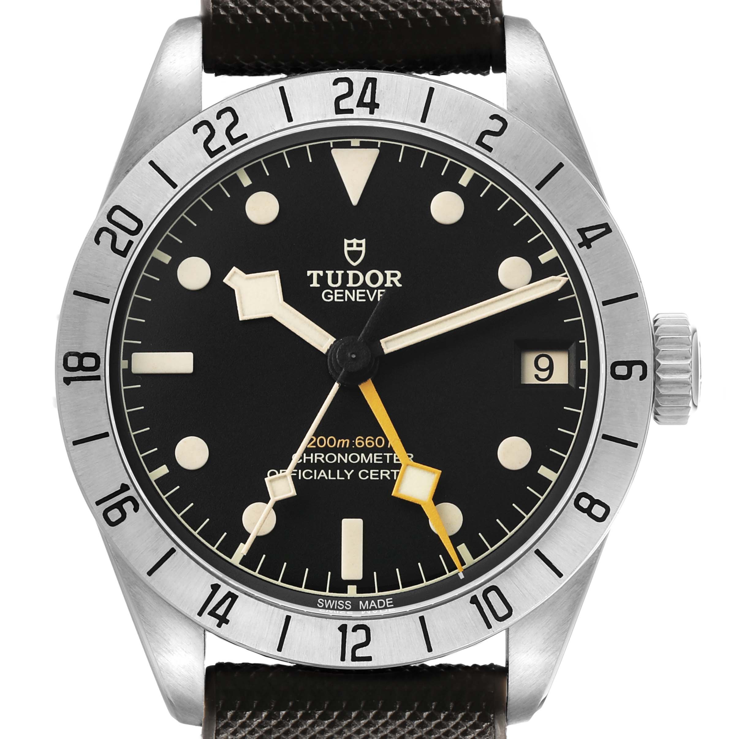 The Tudor Heritage Black Bay 79470 Men's Stainless Steel Black Dial watch is shown from a front angle, displaying the dial, bezel, crown, hands, and date window.
