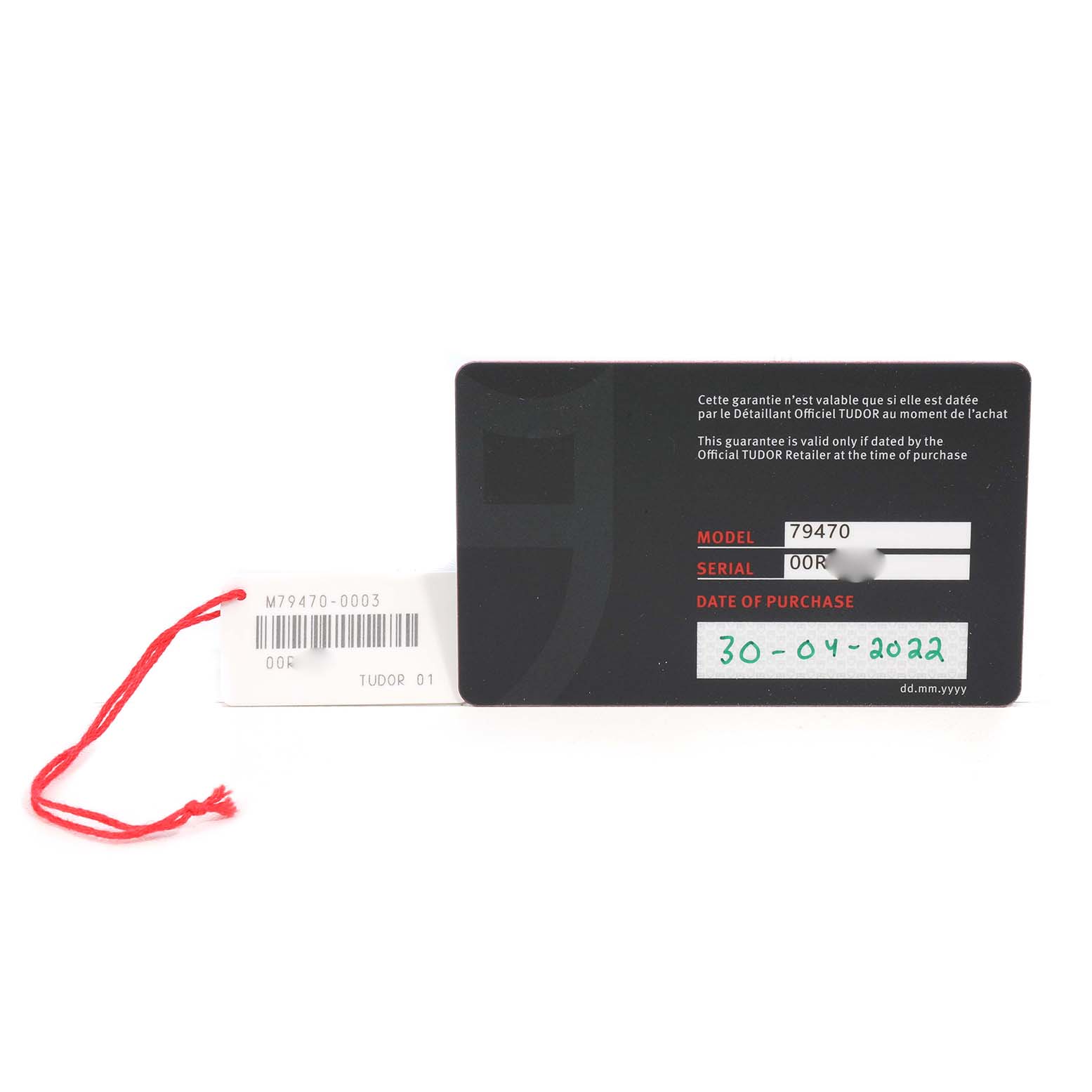 The image shows a Tudor Heritage Black Bay 79470 Men's Stainless Steel Black Dial warranty card and a tag, both displayed flat with visible model and purchase details.