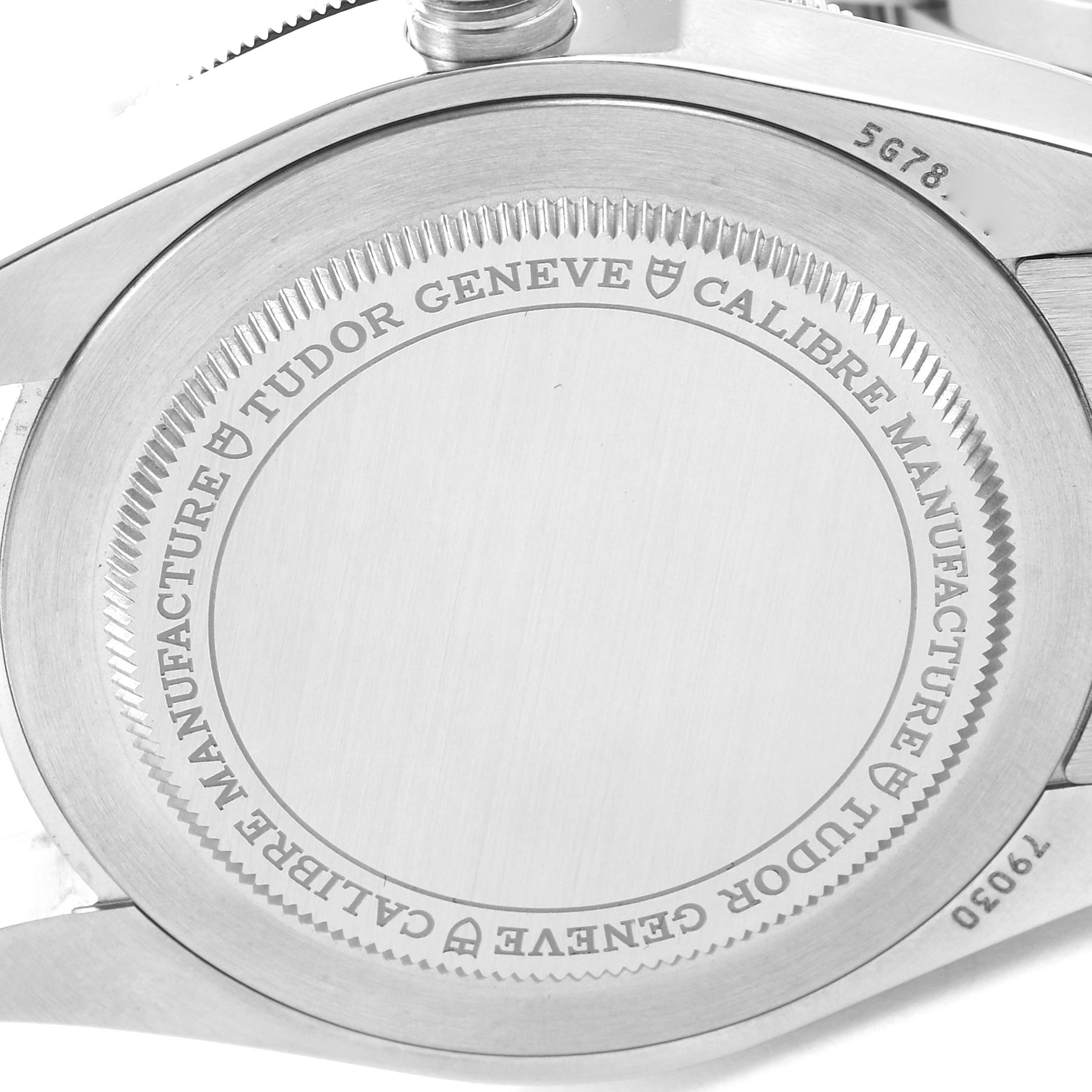 The image shows the back view of the Tudor Heritage Black Bay 79030B Men's Stainless Steel Blue Dial 79030B Men's Stainless Steel Blue Dial watch, displaying the case back with "Tudor Geneve" and "Calibre Manufacture" engravings.