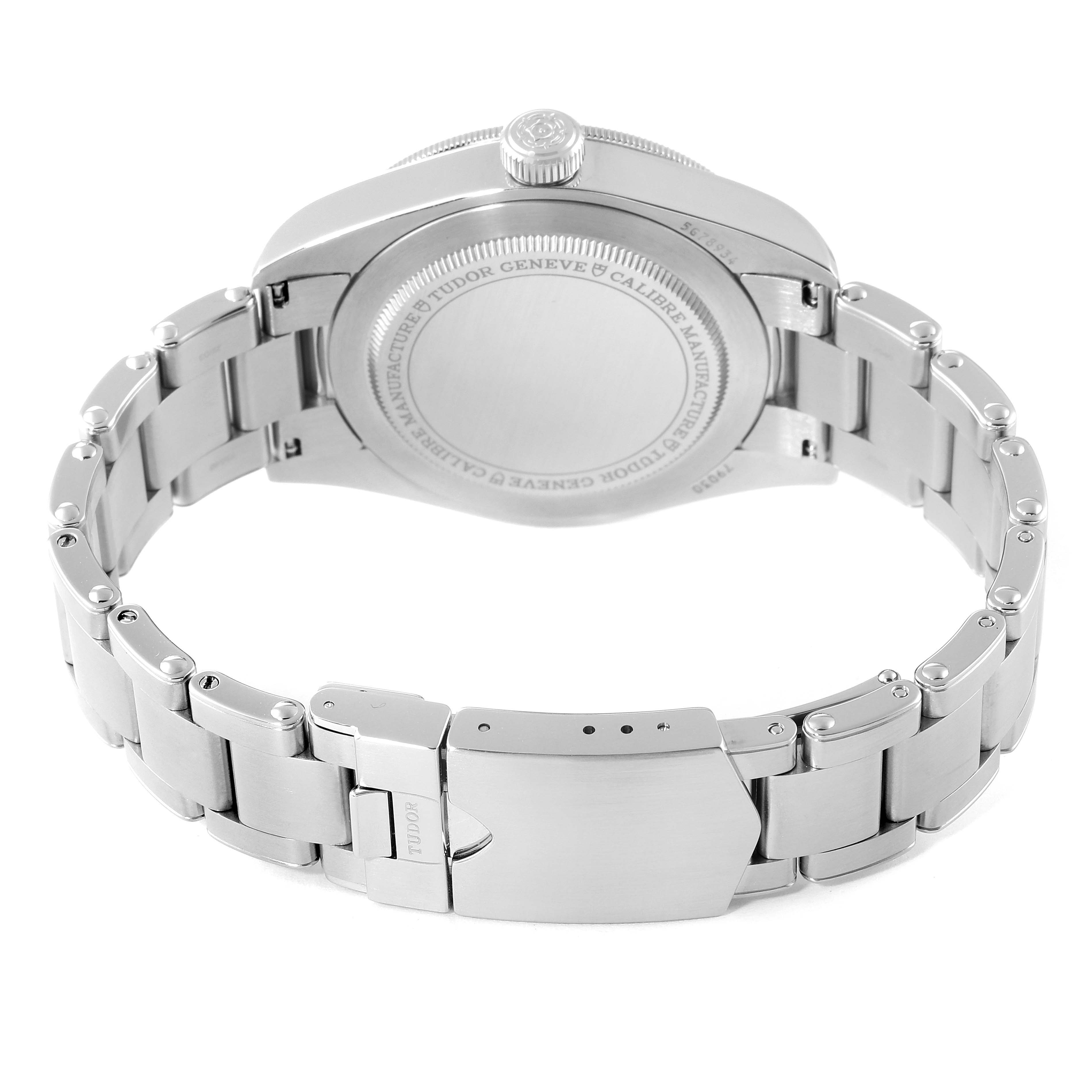 This image shows the back case and metal bracelet of a Tudor Heritage Black Bay 79030B Men's Stainless Steel Blue Dial 79030B Men's Stainless Steel Blue Dial watch.