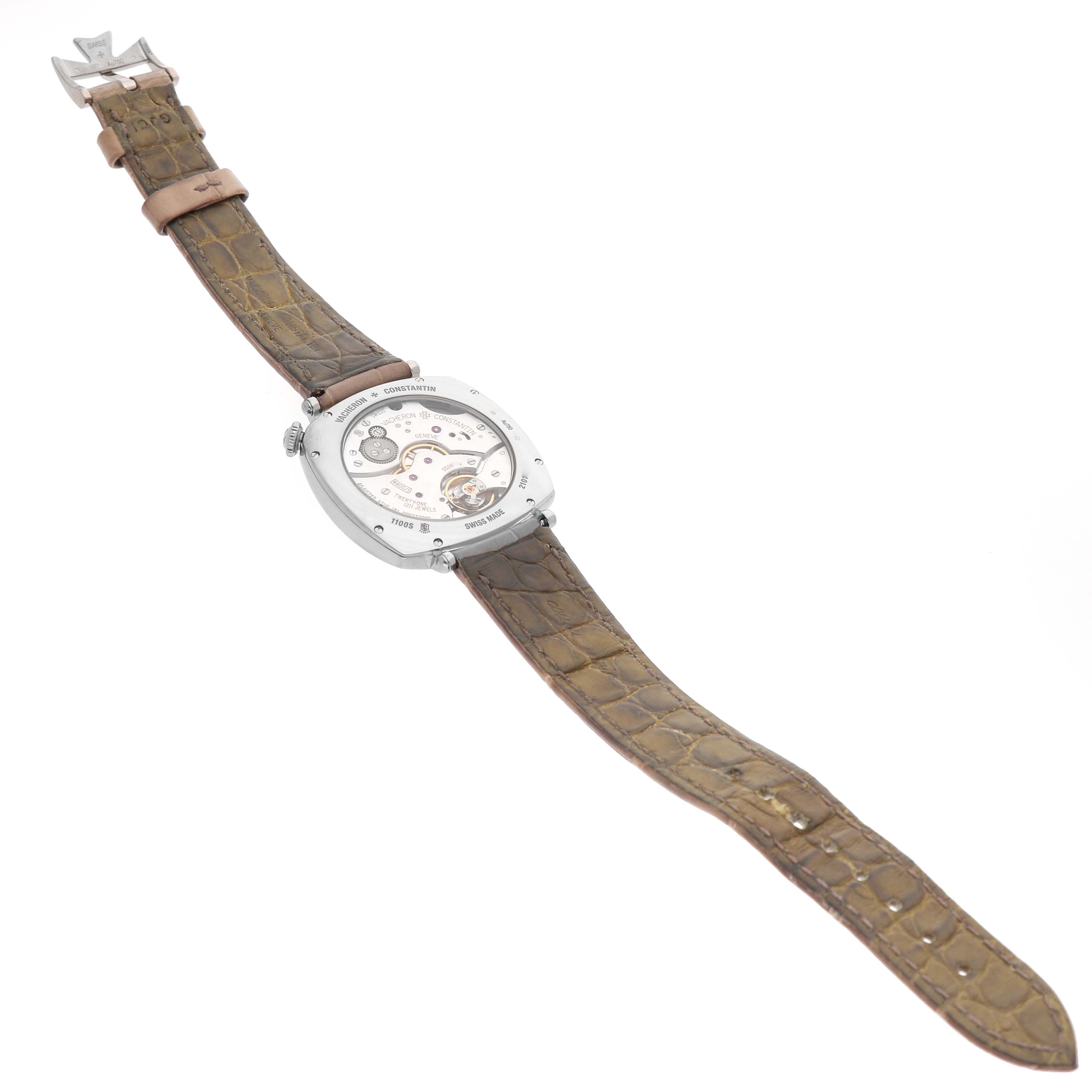 The Vacheron Constantin Historiques 1100S Men's White Gold Silver Dial watch is shown from the back, highlighting the movement and brown leather strap.