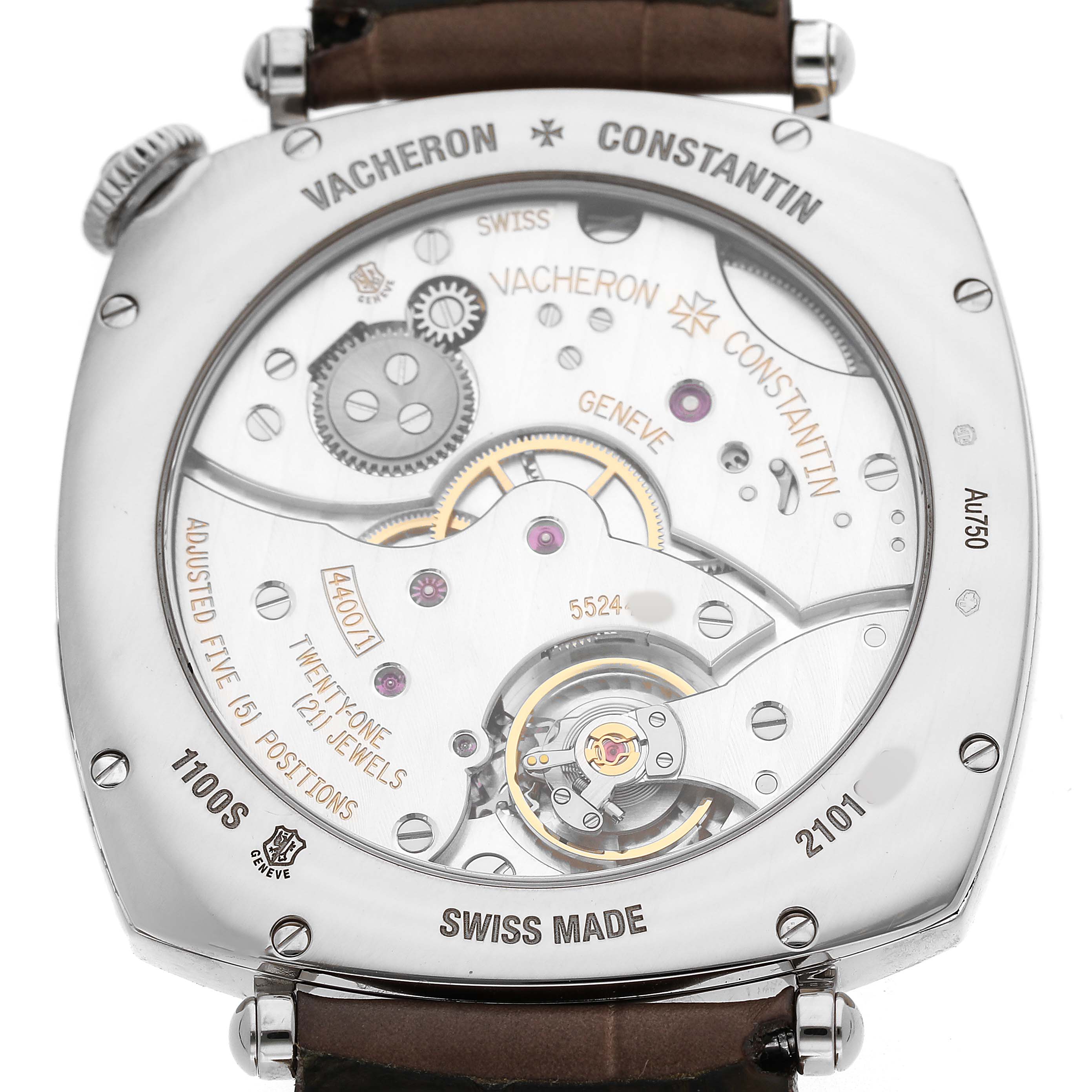 The image shows the back of a Vacheron Constantin Historiques 1100S Men's White Gold Silver Dial watch, highlighting its mechanical movement and engravings.
