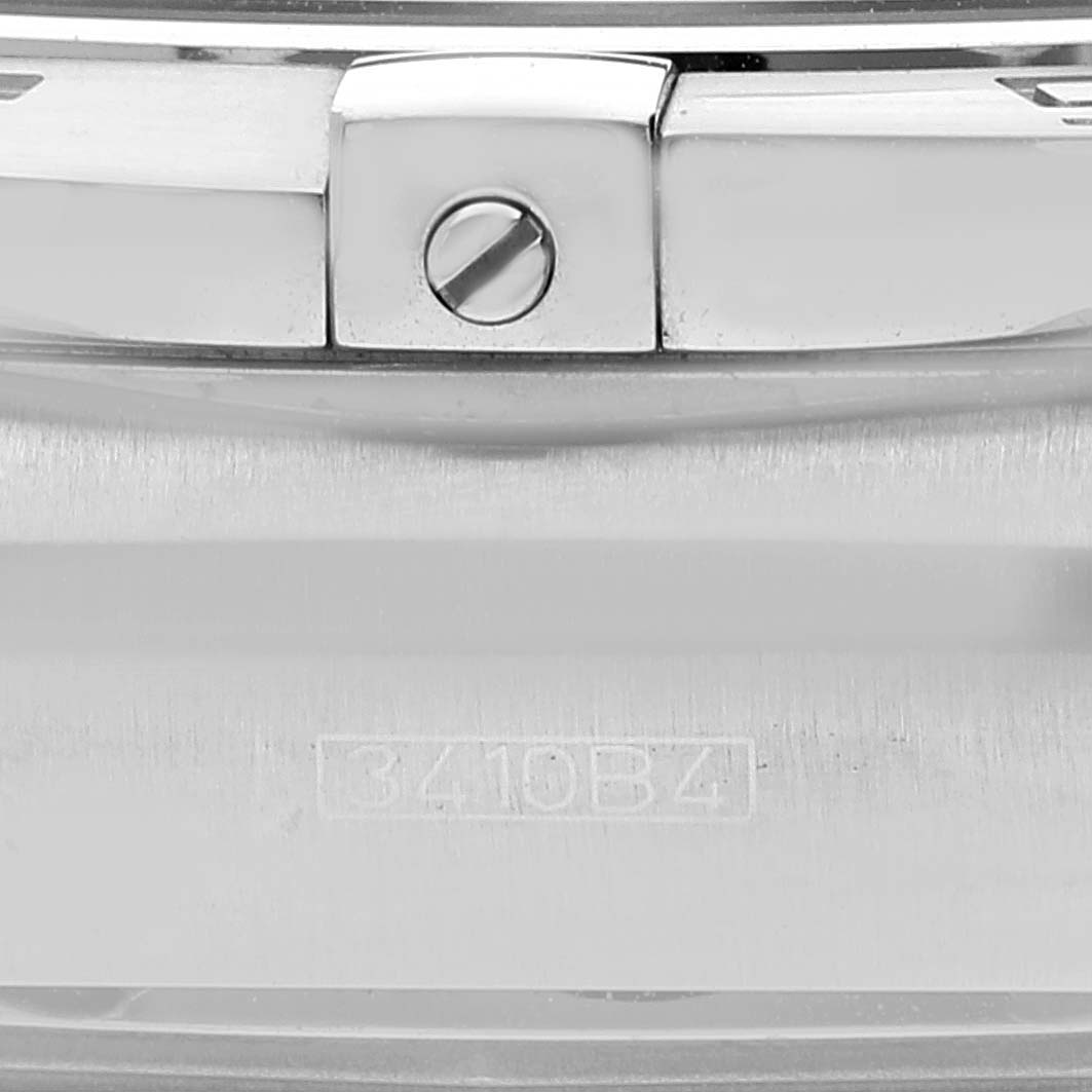 The image shows a close-up of the case back and part of the bezel of a Breitling Chronomat AB011110/BA50-SS Men's Stainless Steel Black Dial AB011110/BA50-SS Men's Stainless Steel Black Dial watch.