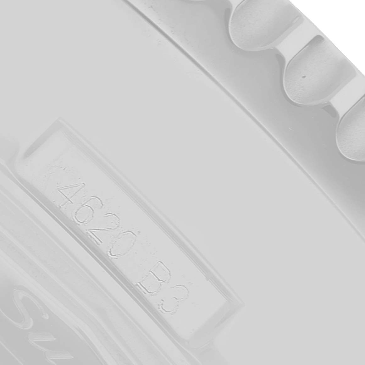 The image shows a close-up of the case back or edge of a Breitling Navitimer AB0127 Men's Stainless Steel Black Dial, highlighting engraved details.