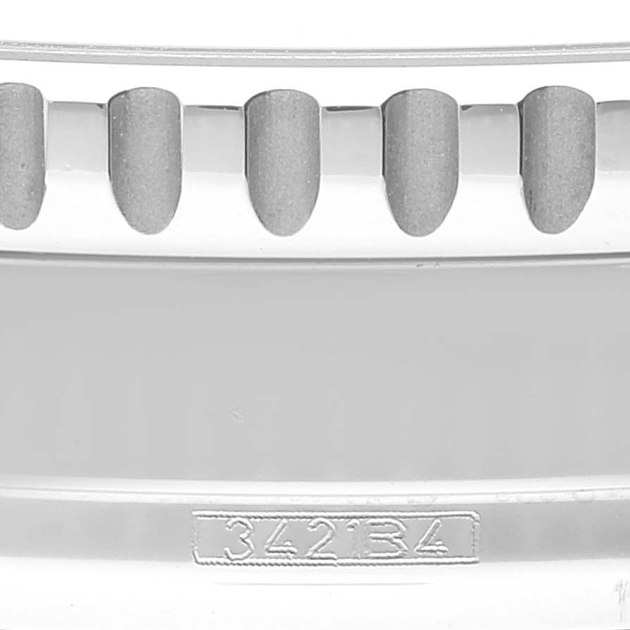 This image shows a close-up of the bezel of a Breitling Navitimer A13324 Men's Stainless Steel Black Dial A13324 Men's Stainless Steel Black Dial watch, including its textured edge and engraved reference number 342134.