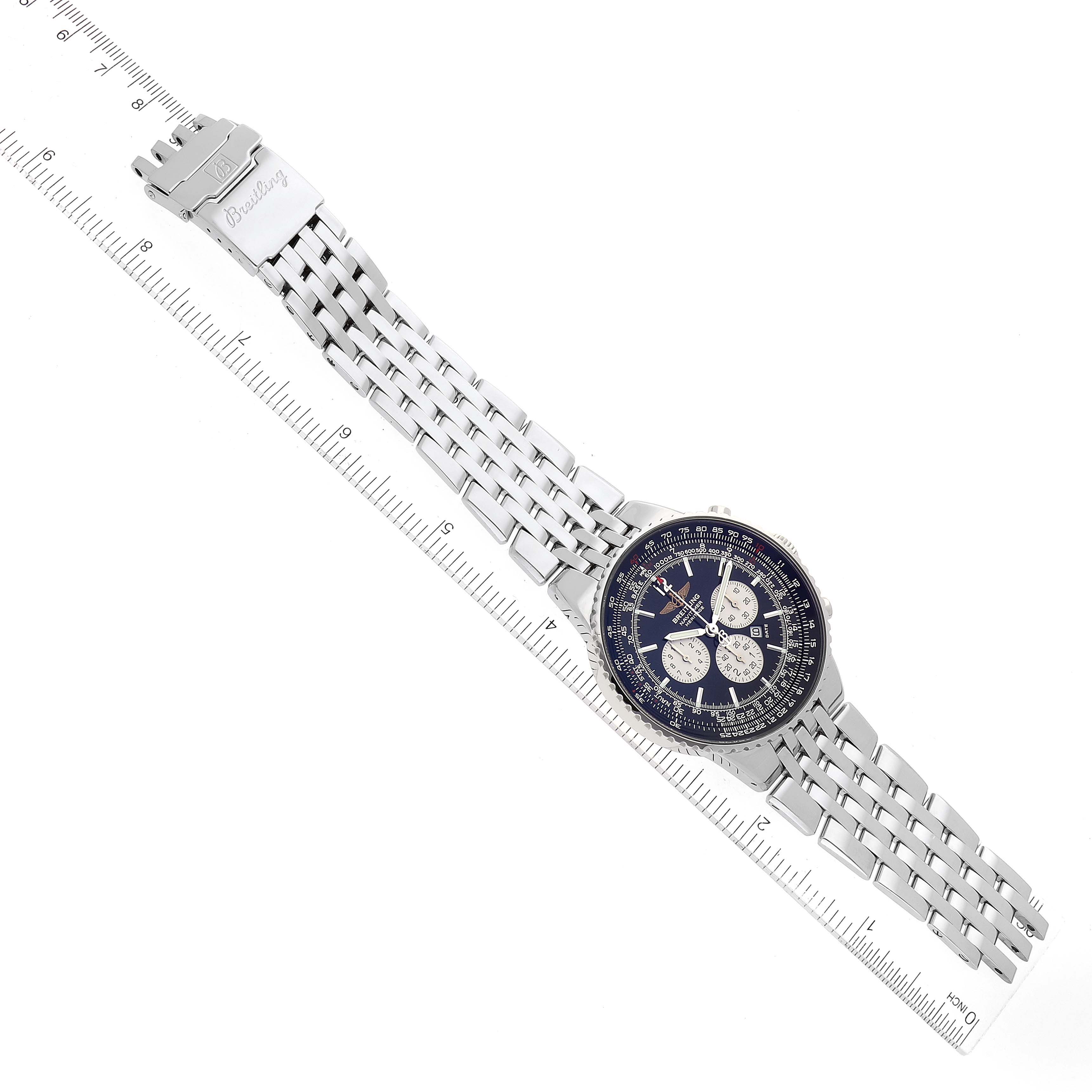 The Breitling Navitimer A35350 Men's Stainless Steel Black Dial A35350 Men's Stainless Steel Black Dial watch is shown at an angled view, displaying its face, band, and clasp alongside a ruler for scale.