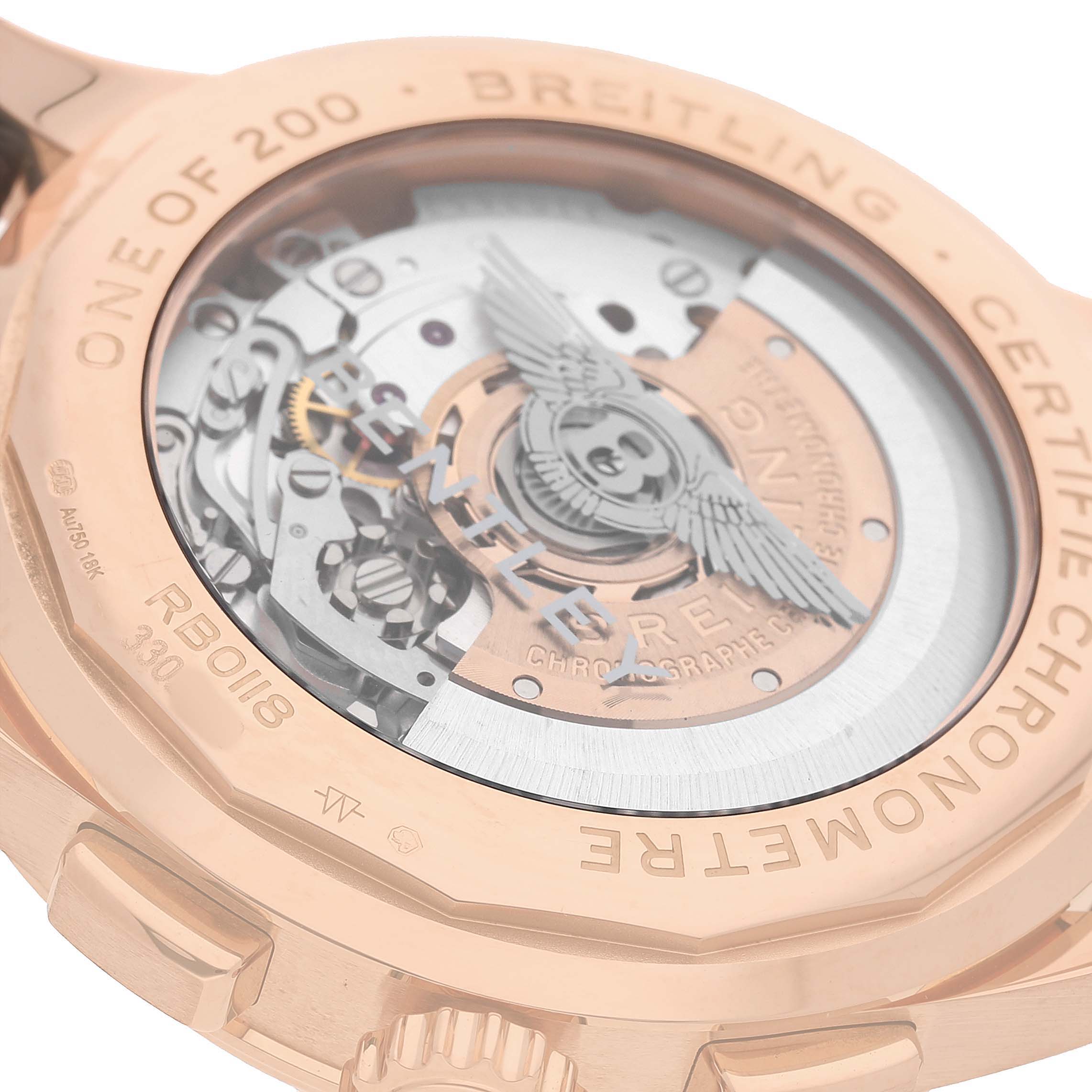 The image shows the case back of the Breitling Premier RB0118 Men's Rose Gold Brown Dial watch, revealing its mechanical movement and rotor.