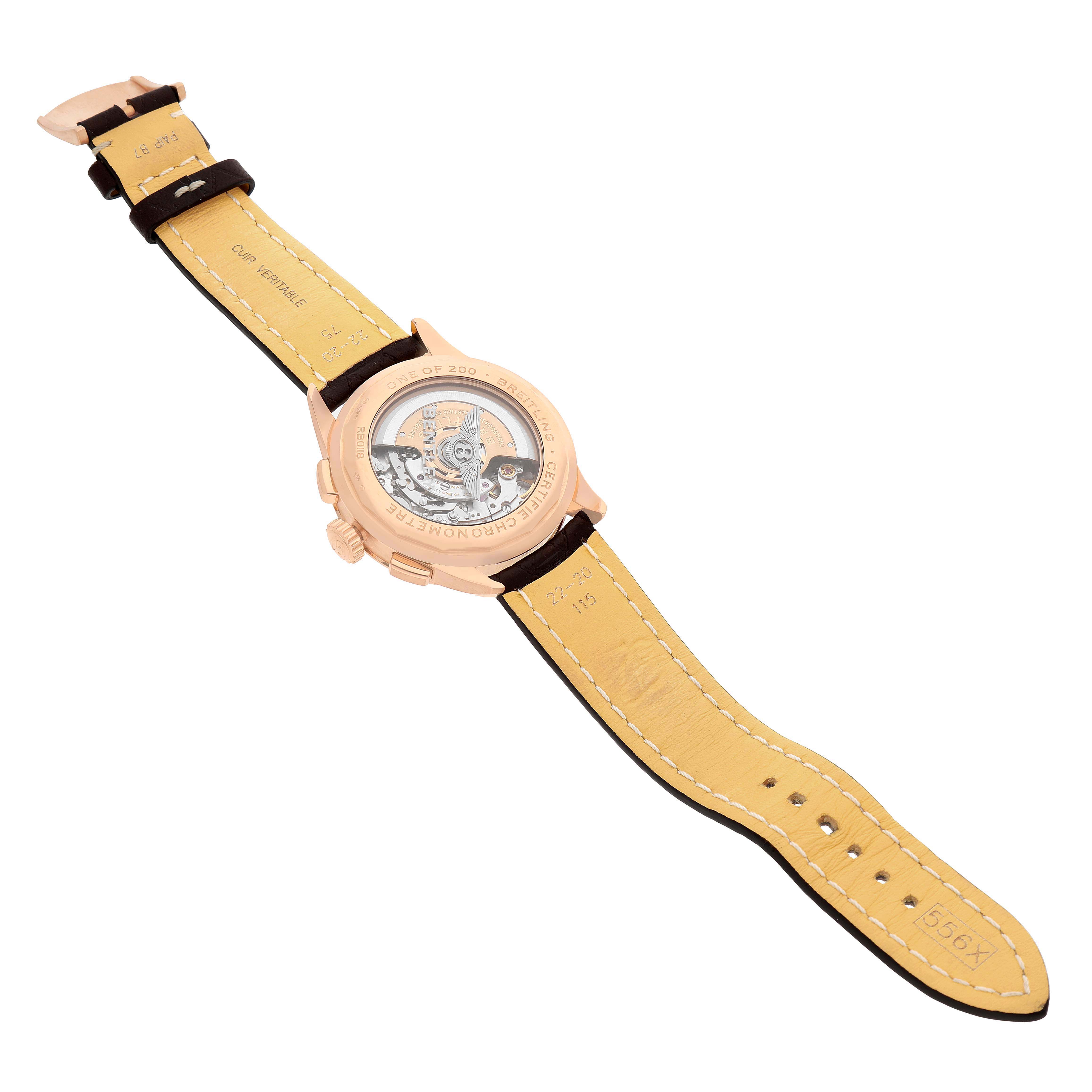 The Breitling Premier RB0118 Men's Rose Gold Brown Dial model watch is shown from a top angle, displaying the transparent case back and leather strap.