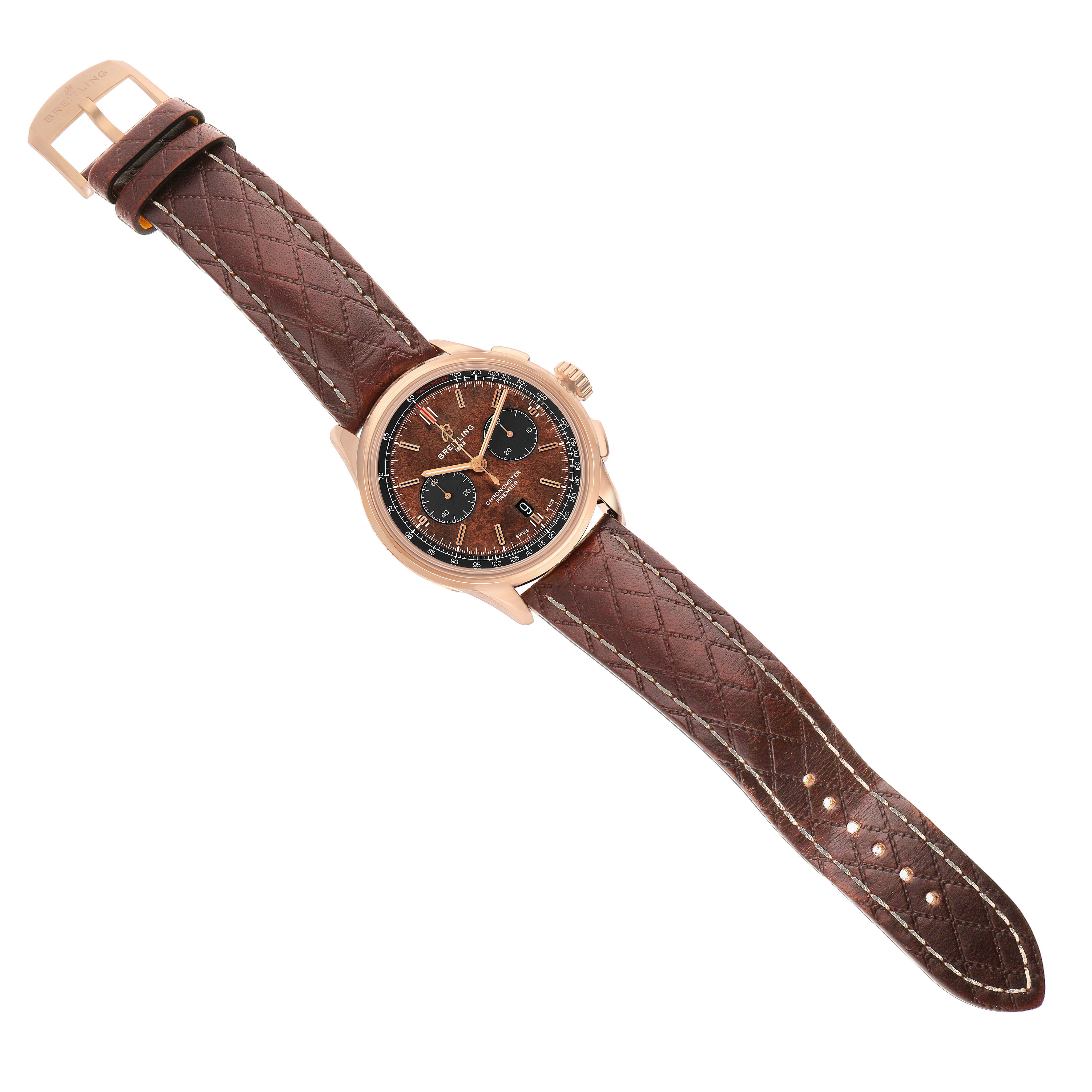 The Breitling Premier RB0118 Men's Rose Gold Brown Dial watch is shown from a top-down angle, highlighting its brown dial, chronograph subdials, and quilted leather strap.