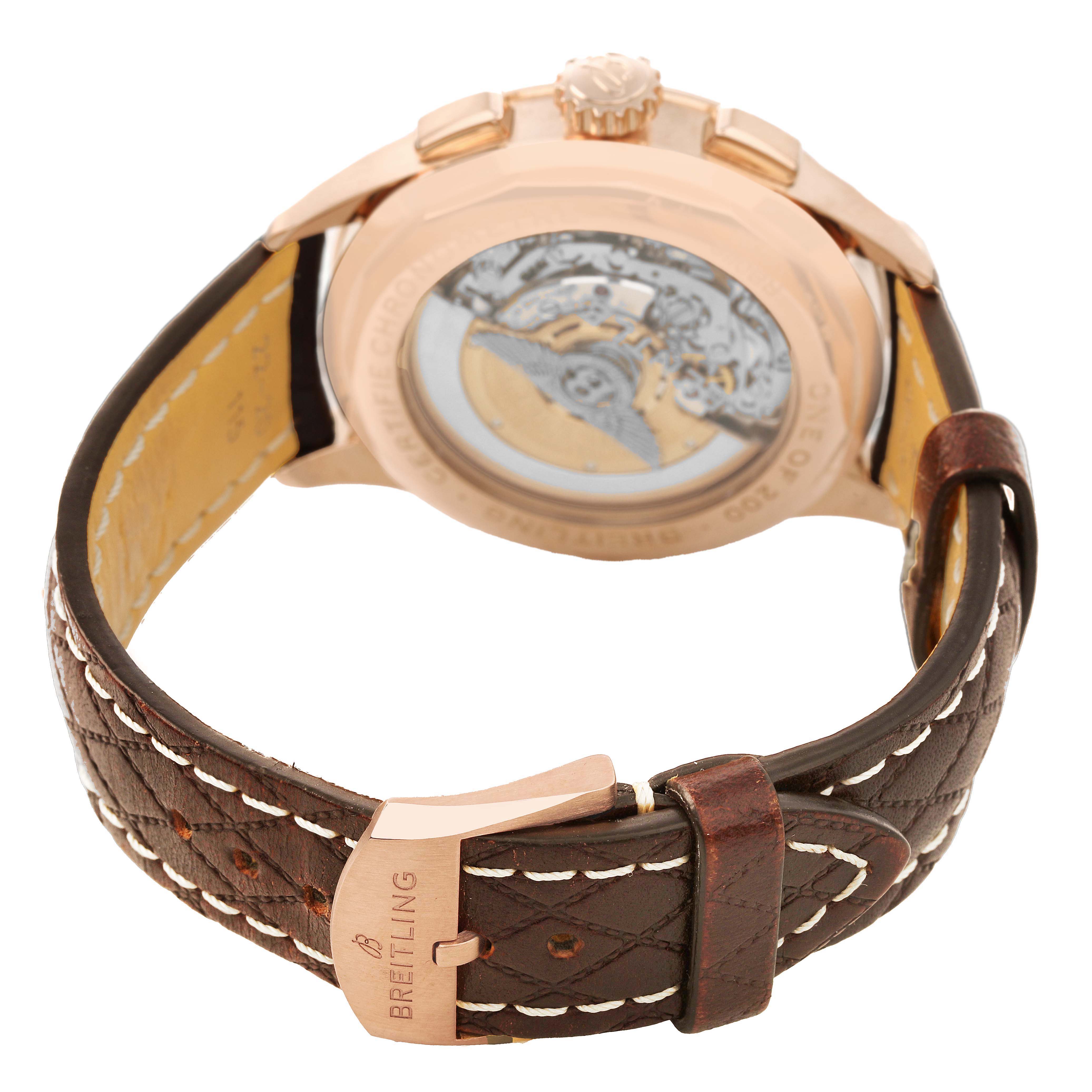 The image shows the back view of a Breitling Premier RB0118 Men's Rose Gold Brown Dial watch, displaying its leather strap, buckle, and transparent case back with visible movement.