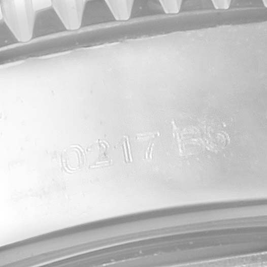 The image shows a close-up angle of the serial number engraving on the case back of a Breitling Superocean A13311 Men
s Stainless Steel Black Dial A13311 Men
s Stainless Steel Black Dial watch.