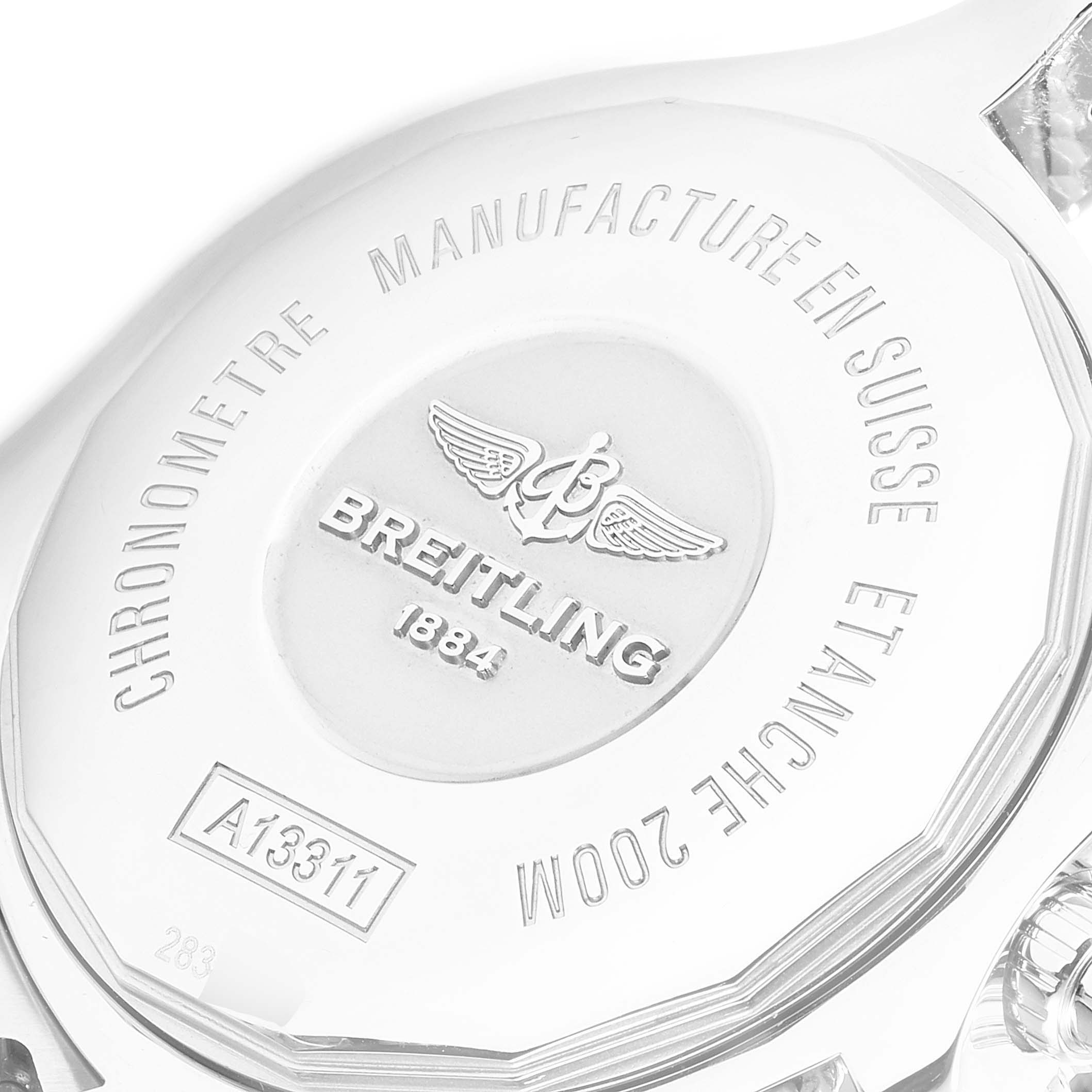 The image shows the back case of a Breitling Superocean A13311 Men
s Stainless Steel Black Dial A13311 Men
s Stainless Steel Black Dial watch, highlighting its engravings and logos.