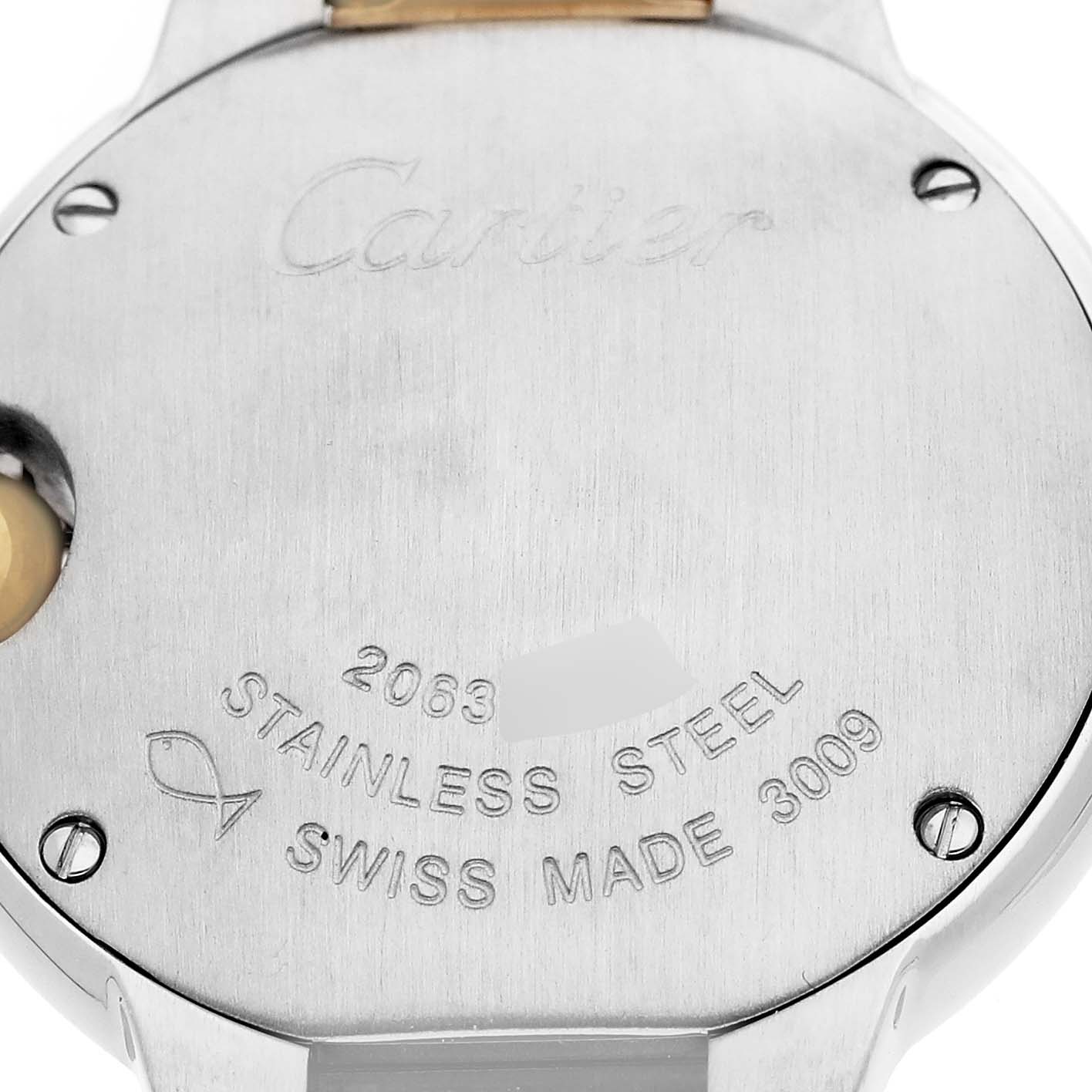 The image shows the back of a Cartier Ballon Bleu W69007Z3 Women's Stainless Steel Silver Dial watch, focusing on the engraved details and screws.