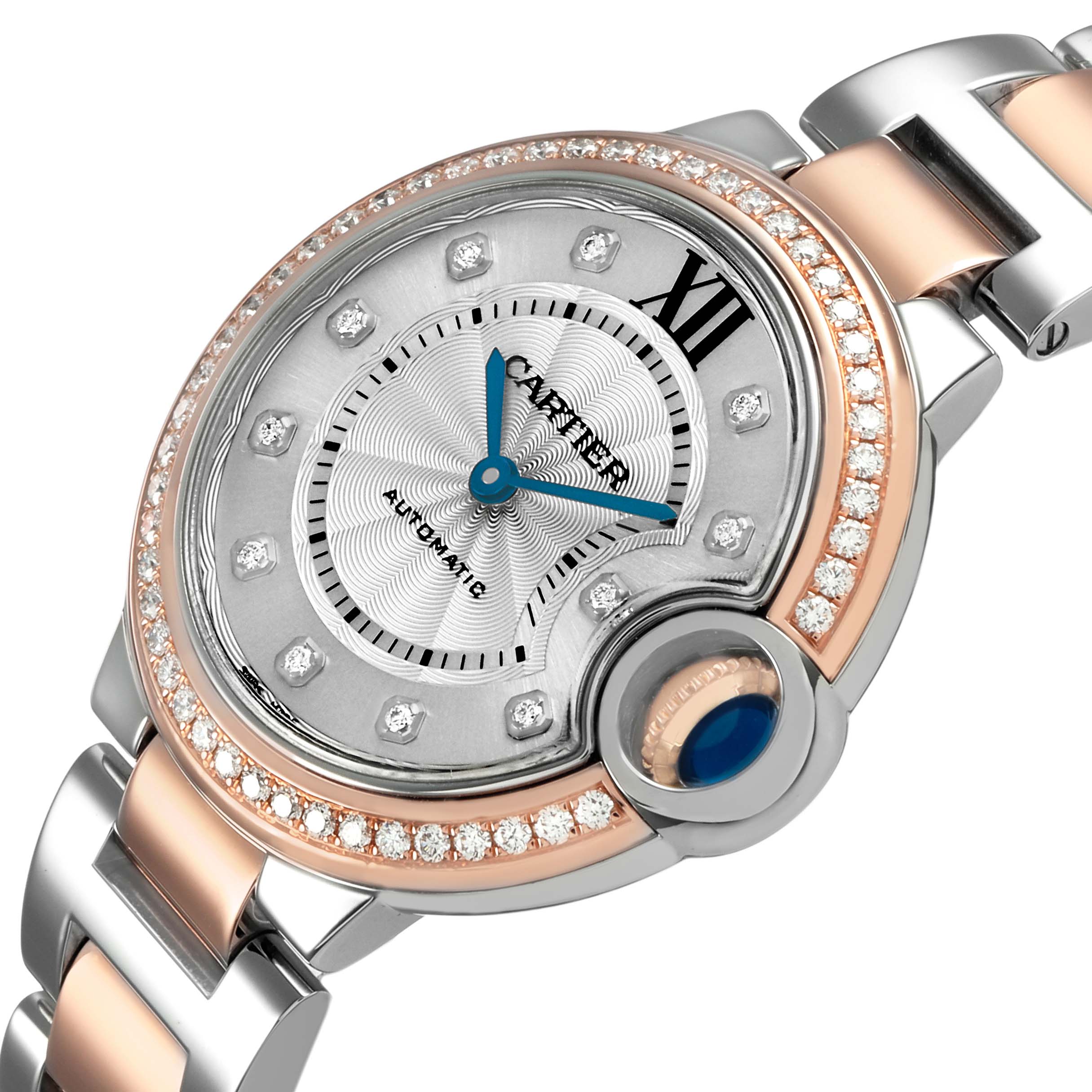 The Cartier Ballon Bleu WE902077 Women's Steel and Gold (two tone) Silver Dial watch is shown at a slight angle, highlighting the face, bezel with diamonds, and part of the bracelet.