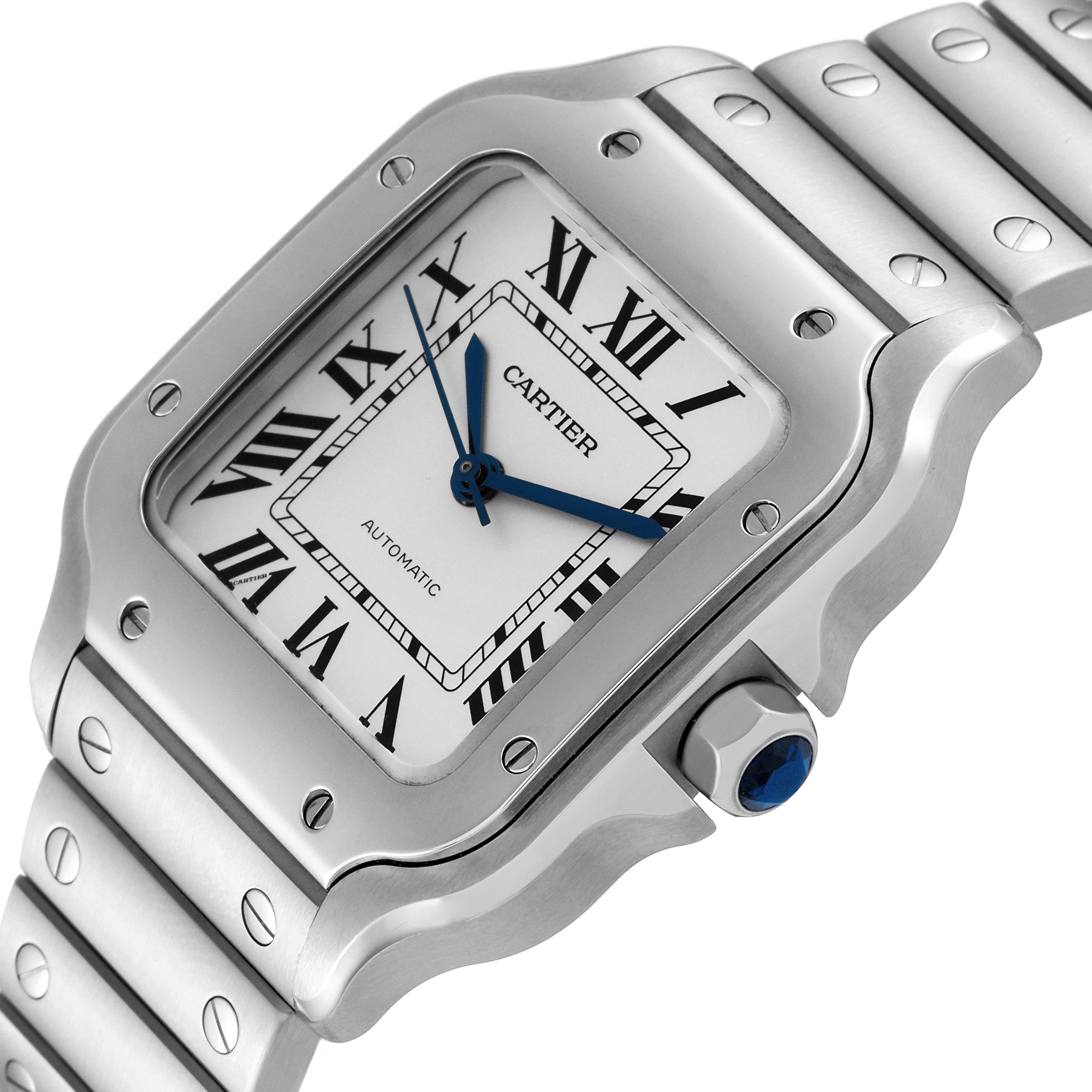 The image shows a close-up angle of the Cartier Santos WSSA0010 Men's Stainless Steel Silver Dial WSSA0010 Men's Stainless Steel Silver Dial watch face, bezel, crown, and part of the metal bracelet.