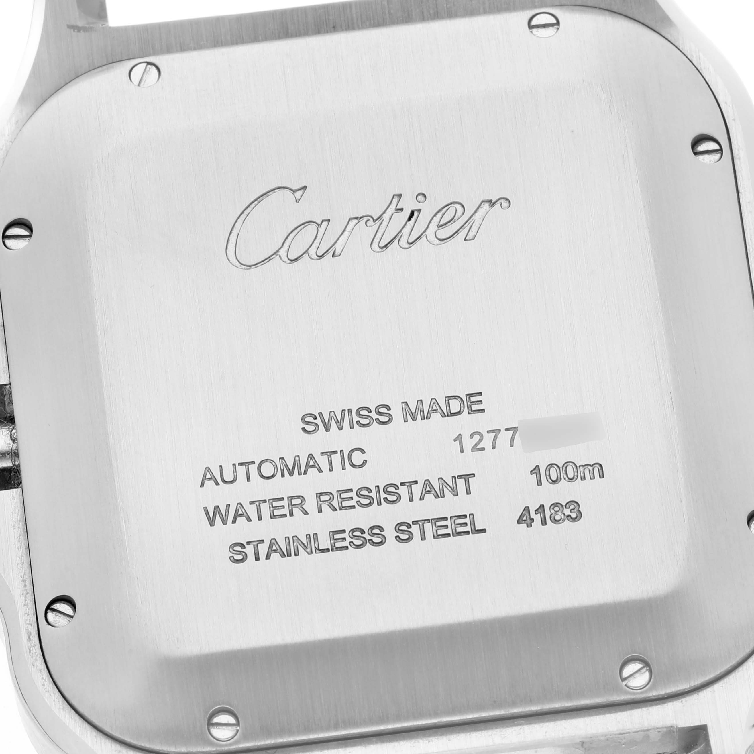 The image shows the back case of a Cartier Santos WSSA0017 Men's Stainless Steel Silver Dial WSSA0017 Men's Stainless Steel Silver Dial model watch, focusing on its engravings.