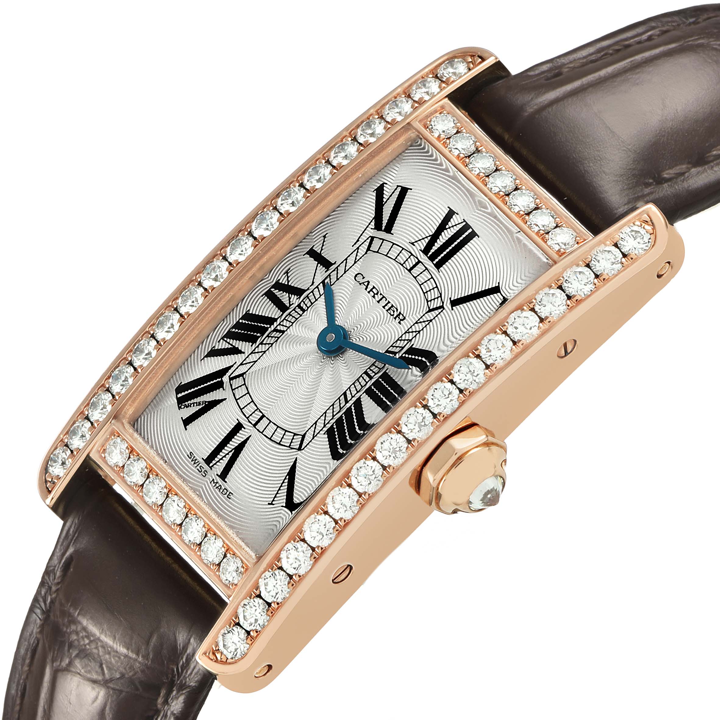 The Cartier Tank Americaine WJTA0002 Women's Rose Gold Silver Dial watch is shown from an angled top view, highlighting its diamond-studded bezel, dial, and crown.