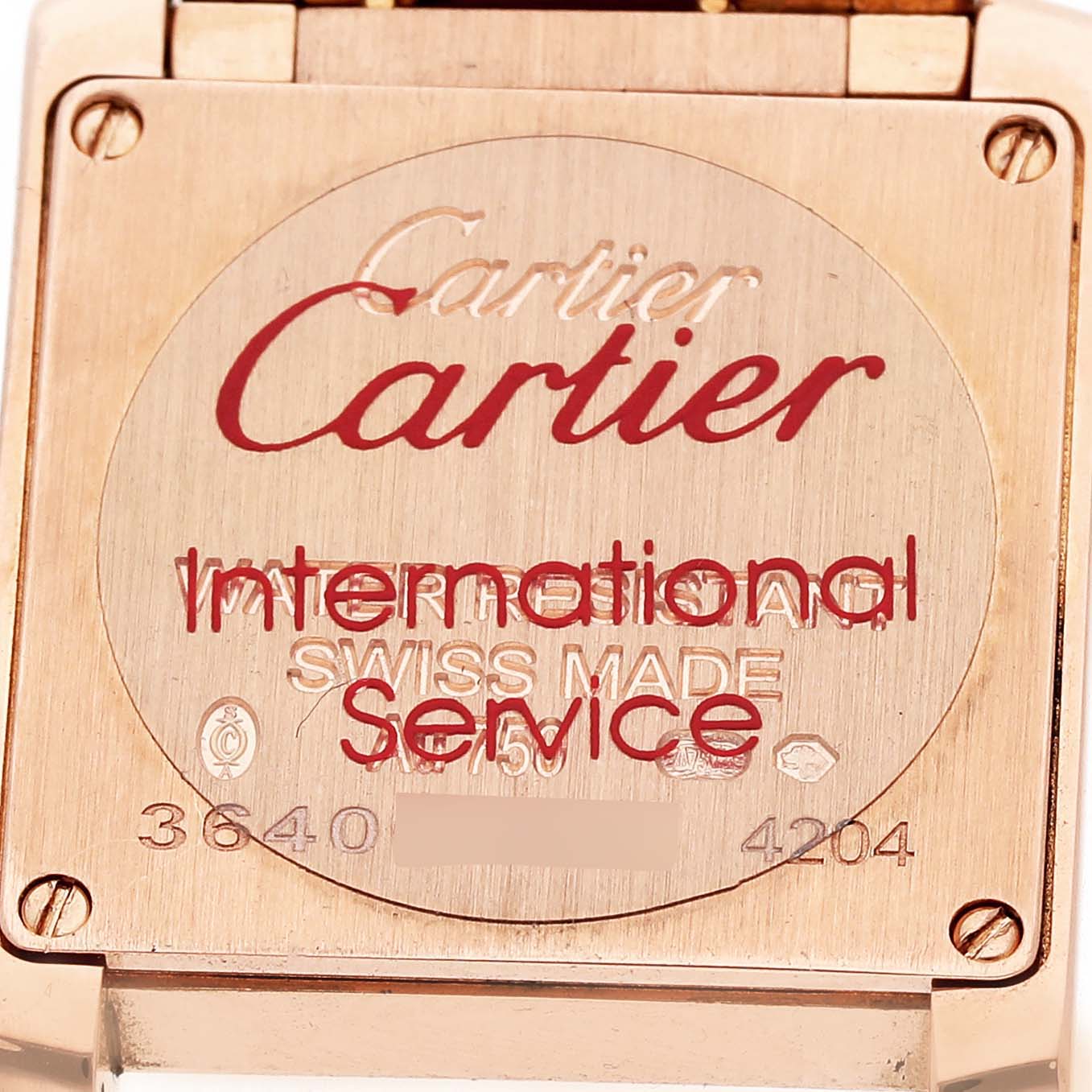 The image shows the backplate of the Cartier Tank Francaise WGTA0029 Women's Rose Gold Silver Dial watch with engraving and serial numbers visible.