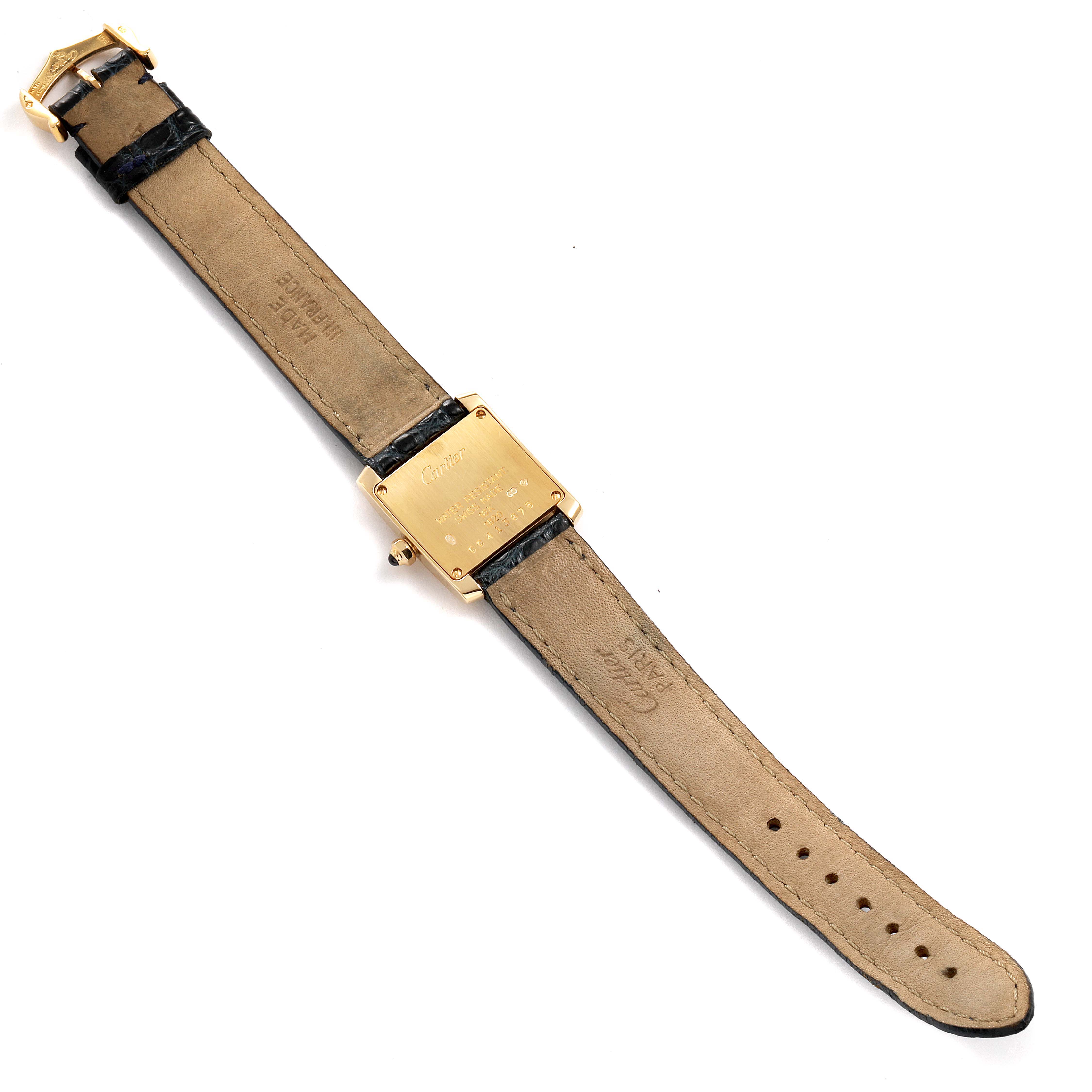 The image shows the back view of a Cartier Tank Francaise W5000256 Women's Yellow Gold Silver Dial W5000256 Women's Yellow Gold Silver Dial watch, displaying its leather strap and gold case back.