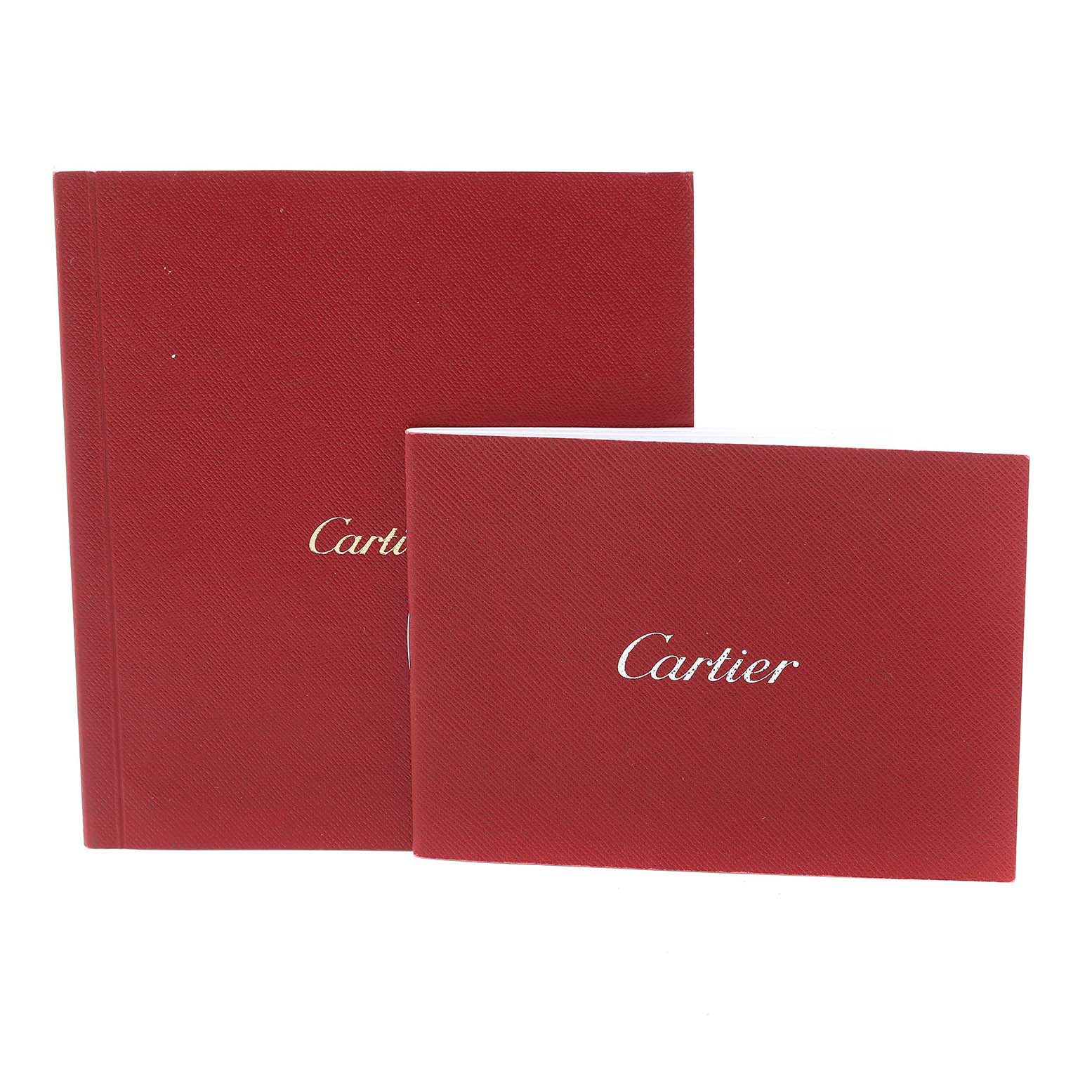 The image shows two red booklets with "Cartier" on the cover, likely accessories for the Tank Solo model by Cartier.