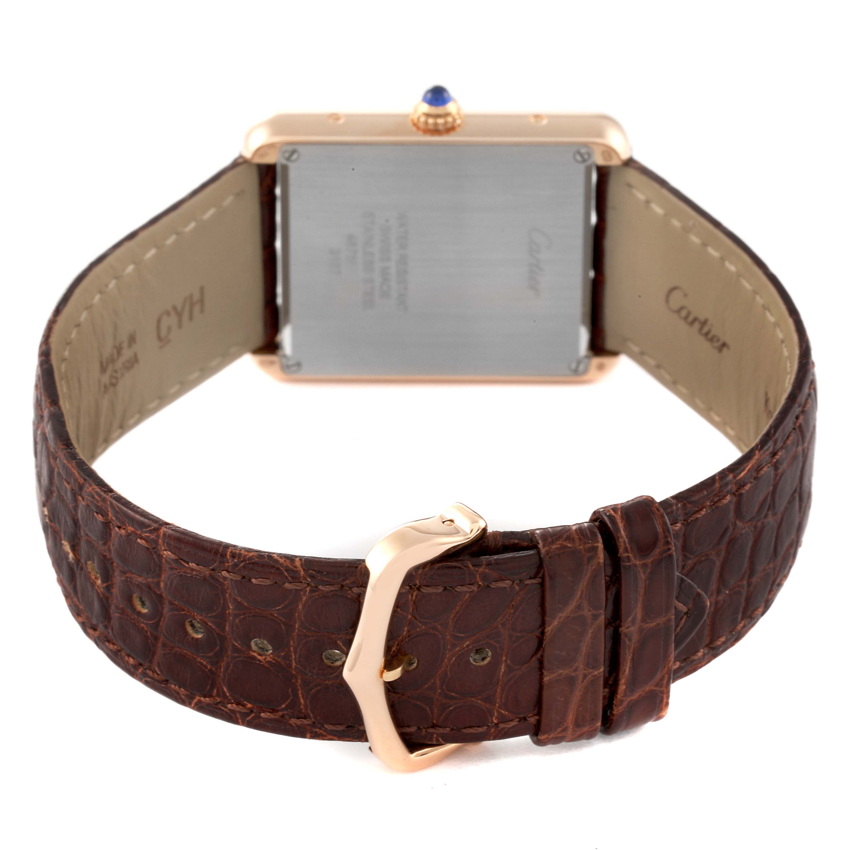 The image shows the back of the Cartier Tank Solo W5200025 Men's Rose Gold Silver Dial W5200025 Men's Rose Gold Silver Dial watch, highlighting its brown leather strap and gold buckle clasp.