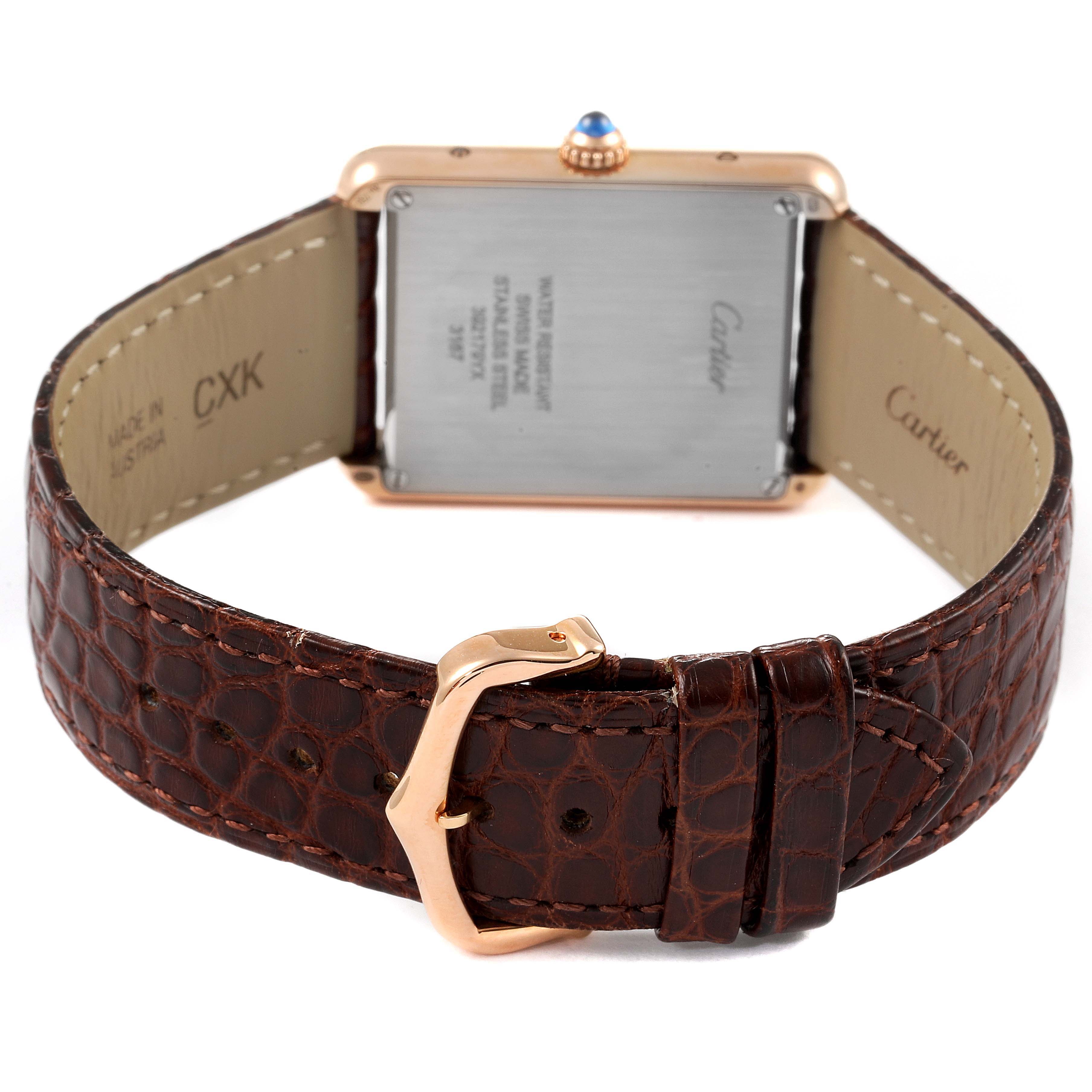 The image shows the back of a Cartier Tank Solo W5200025 Men's Rose Gold Silver Dial W5200025 Men's Rose Gold Silver Dial watch, highlighting the case back, leather strap, and clasp.