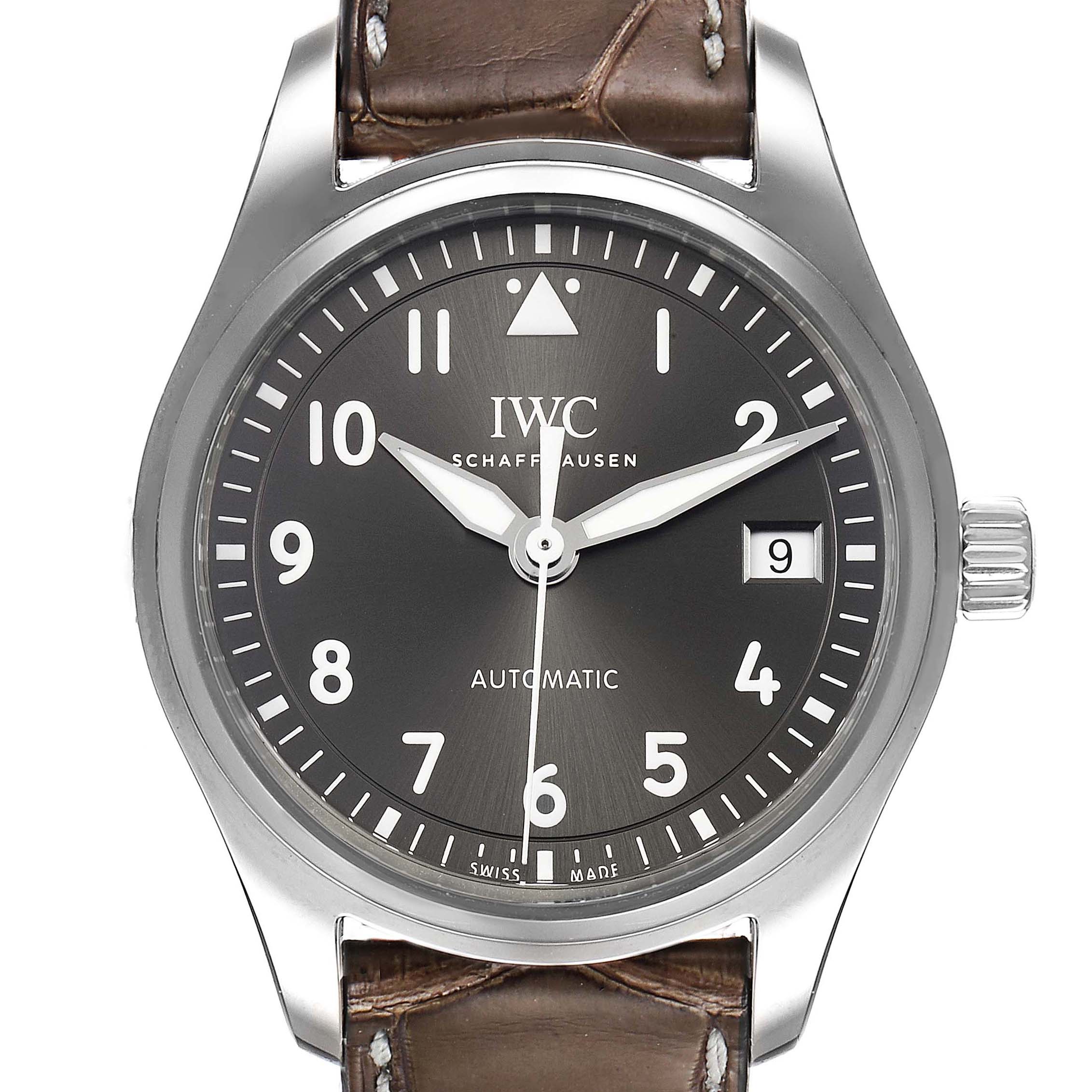 The image shows the face, bezel, and partial strap of an IWC Pilot IW324001 Men's Stainless Steel Grey Dial IW324001 Men's Stainless Steel Grey Dial model watch, with the crown and date visible.