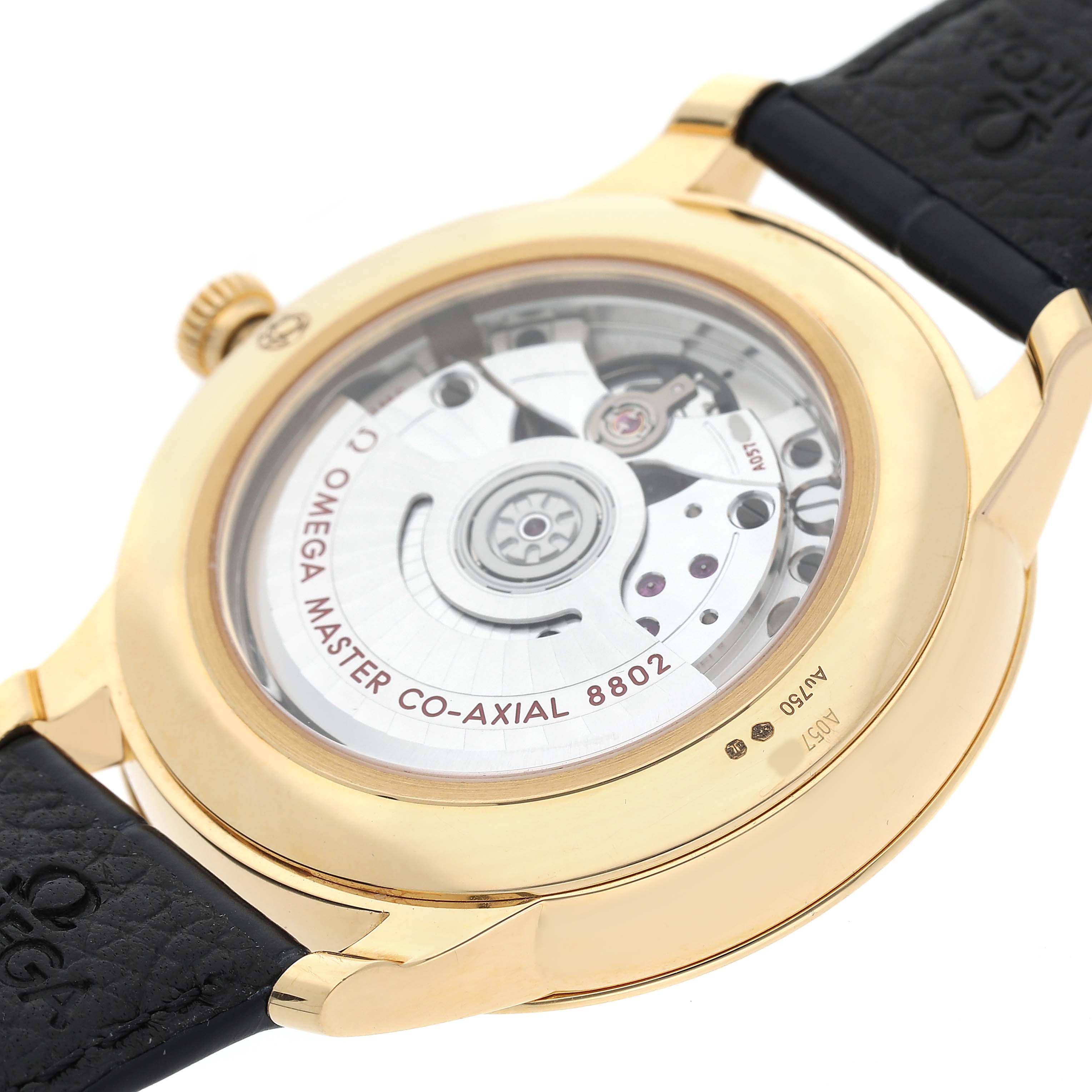 The image shows the back view of an Omega De Ville 434.53.41.20.02.001 Men's Yellow Gold Silver Dial watch, highlighting the movement mechanism.