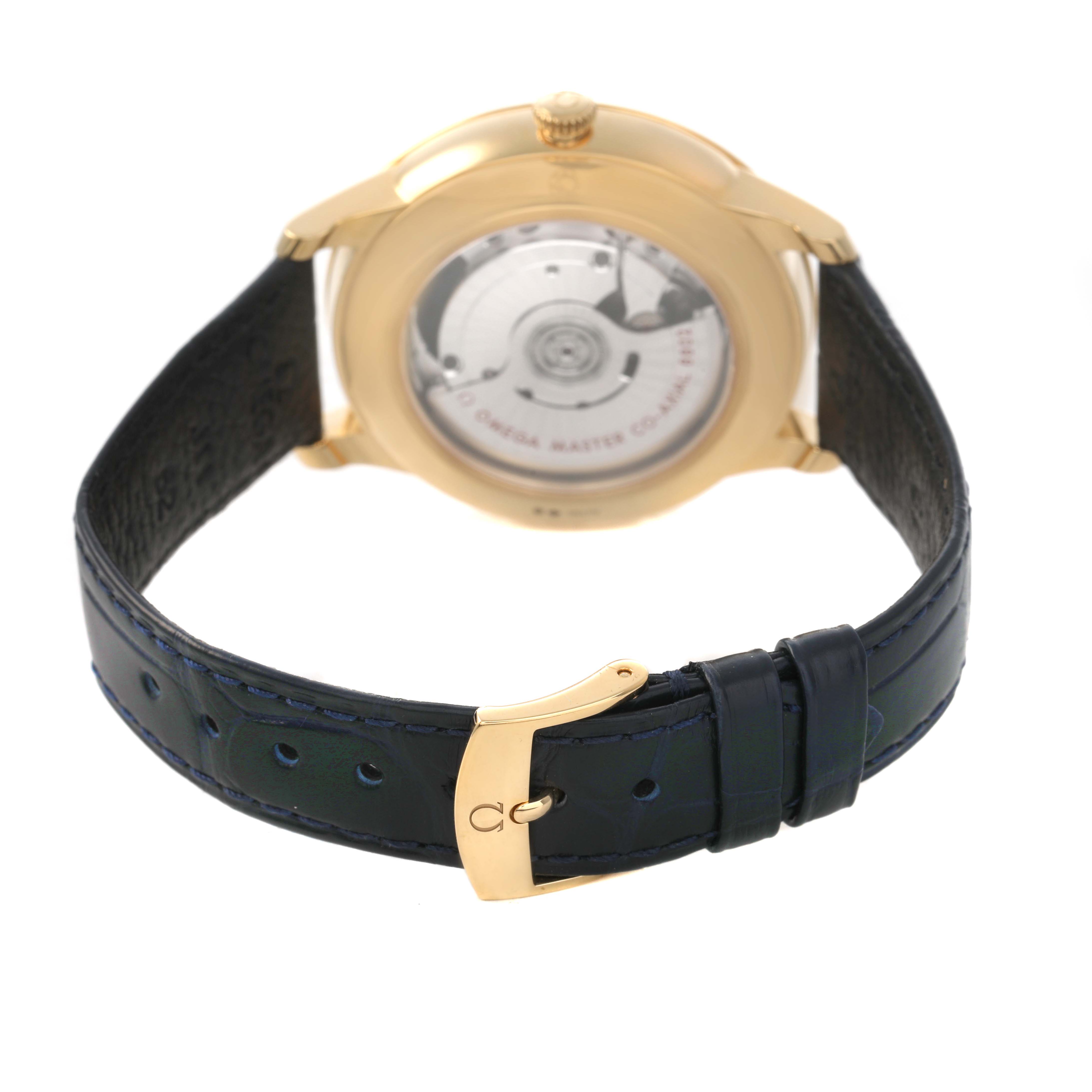 The image shows the back of an Omega De Ville 434.53.41.20.02.001 Men's Yellow Gold Silver Dial watch, highlighting the movement and clasp.
