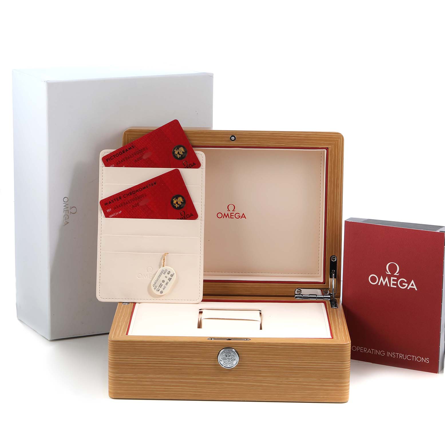 The image shows the Omega De Ville 434.53.41.20.02.001 Men's Yellow Gold Silver Dial watch box, cards, and operating instructions from a frontal angle.