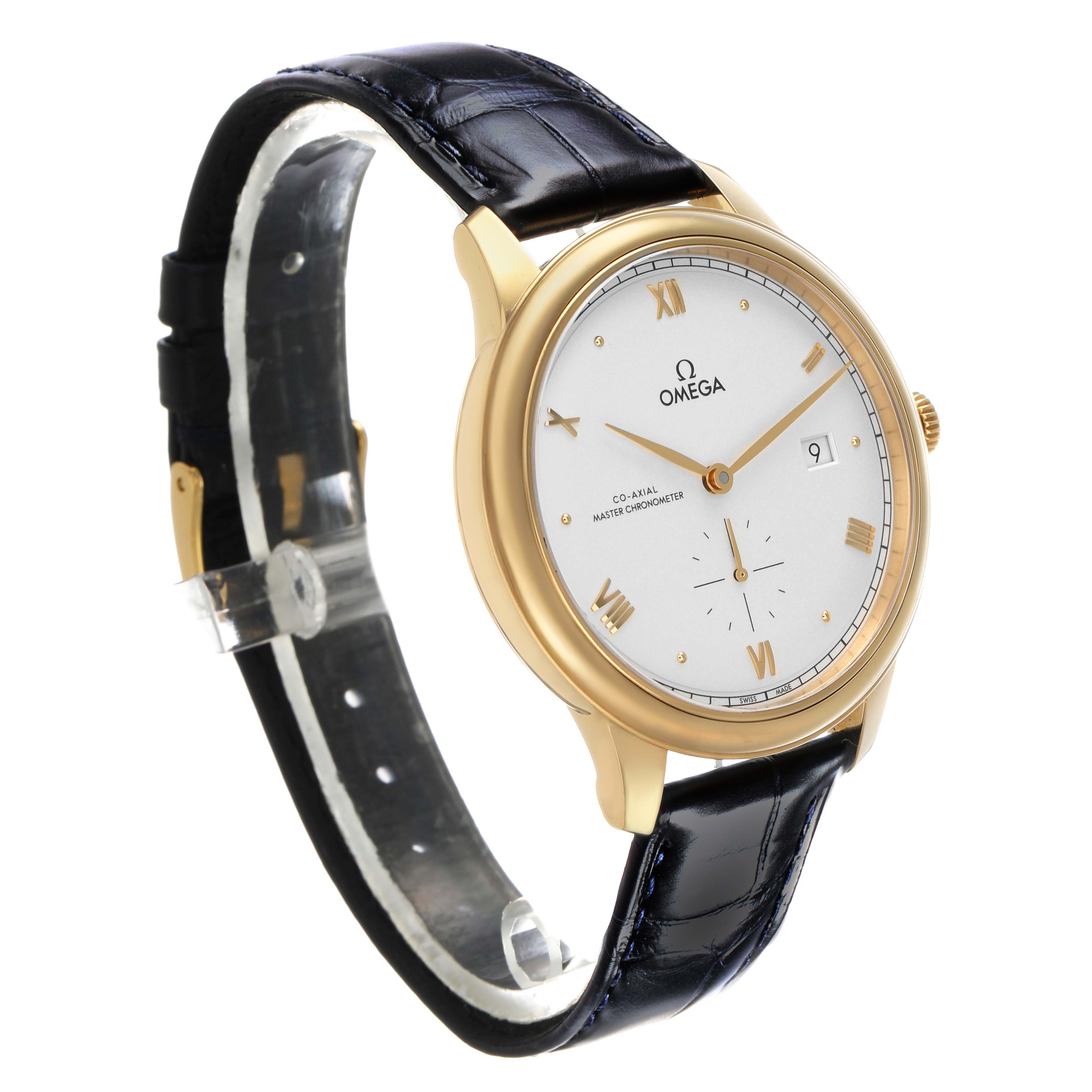 The Omega De Ville 434.53.41.20.02.001 Men's Yellow Gold Silver Dial watch is shown at a three-quarter angle, displaying the face, bezel, and strap with Roman numerals and date.