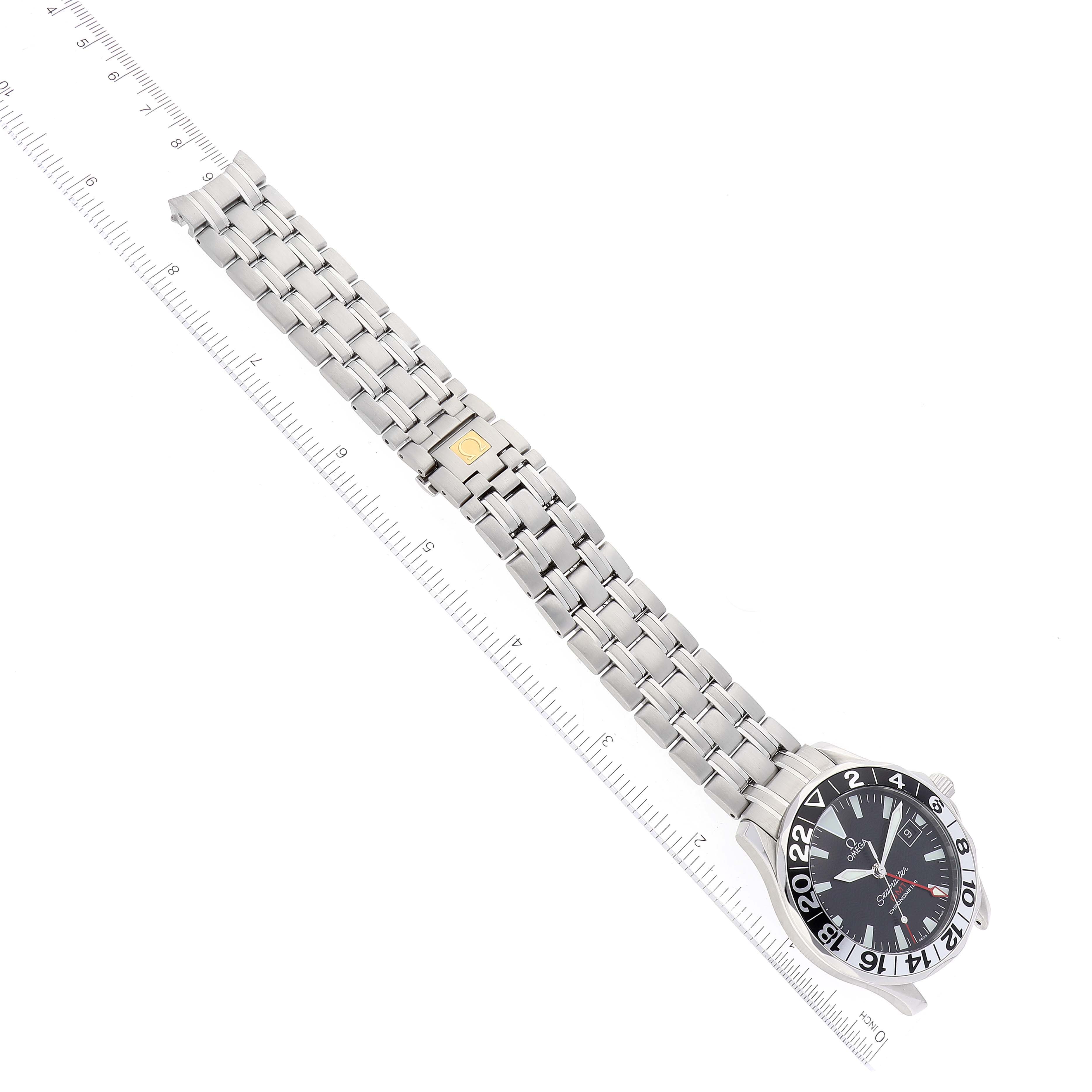 The image shows an Omega Seamaster 2534.50.00 Men's Stainless Steel Black Dial 2534.50.00 Men's Stainless Steel Black Dial watch laid flat with a ruler beside it, displaying the watch face and metal bracelet.