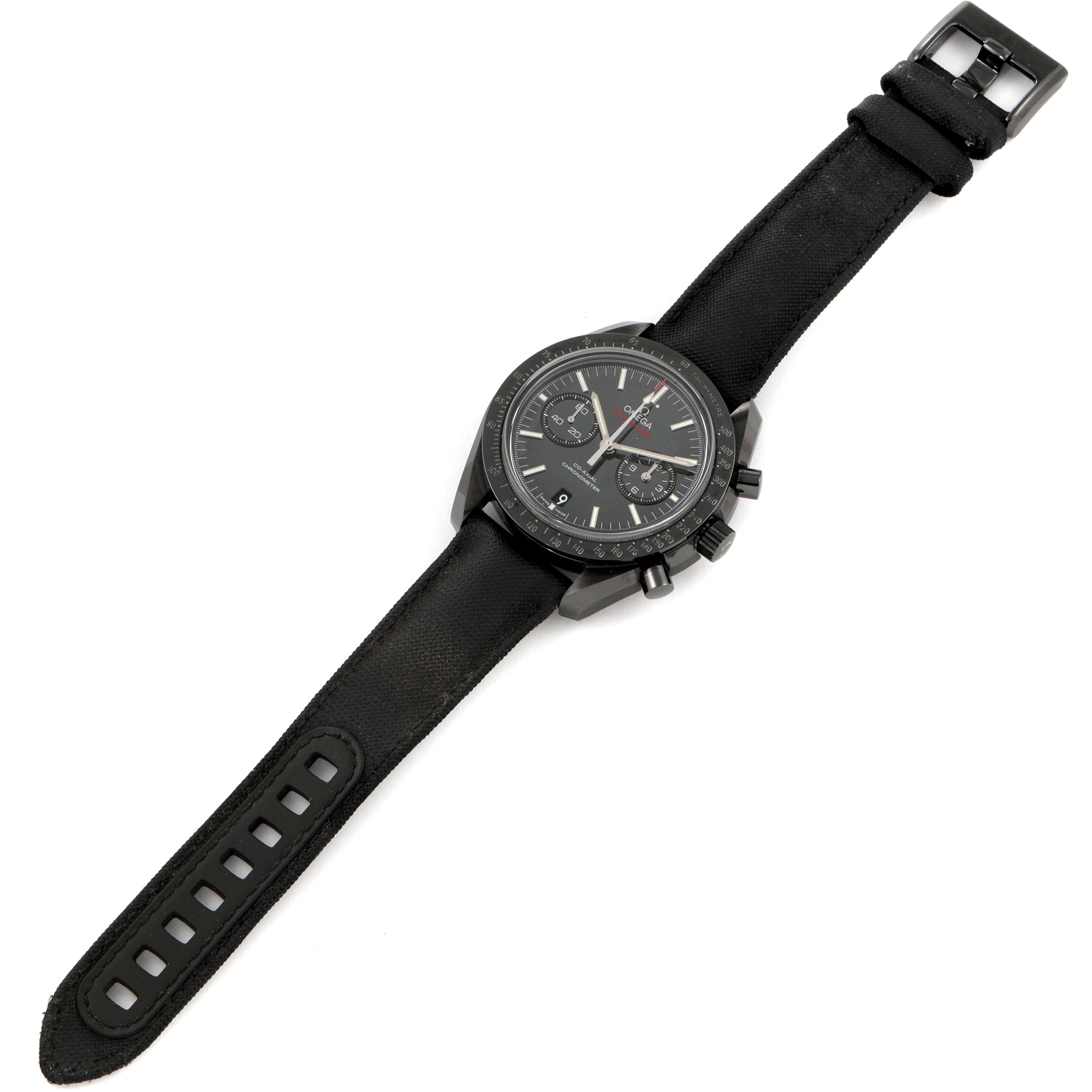 This image shows an Omega Speedmaster 311.92.44.51.01.003 Men
s Ceramic Black Dial 311.92.44.51.01.003 Men
s Ceramic Black Dial watch from a top-down angle, with its strap fully extended.