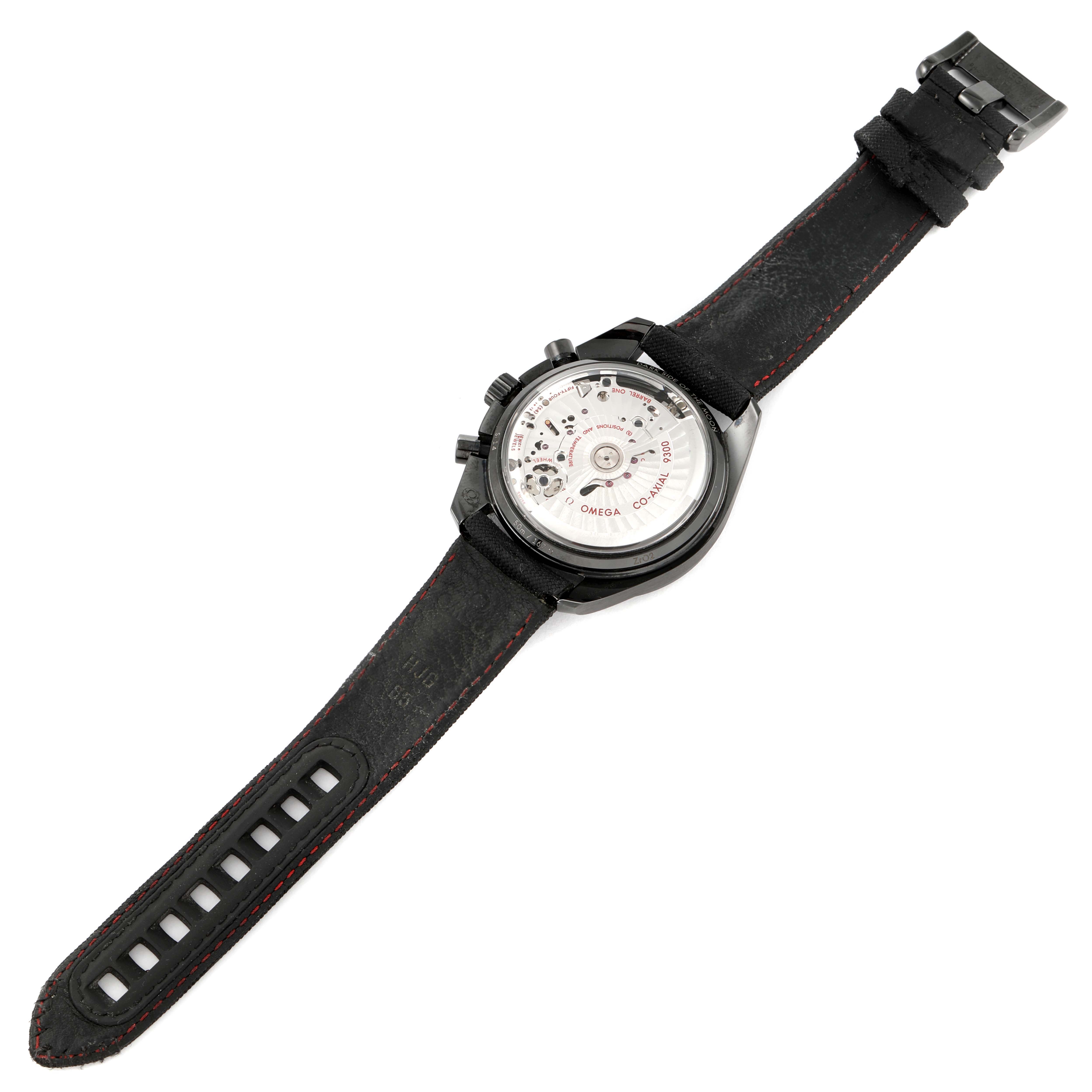 The image shows the back view of an Omega Speedmaster 311.92.44.51.01.003 Men
s Ceramic Black Dial 311.92.44.51.01.003 Men
s Ceramic Black Dial watch, highlighting its movement and leather strap.