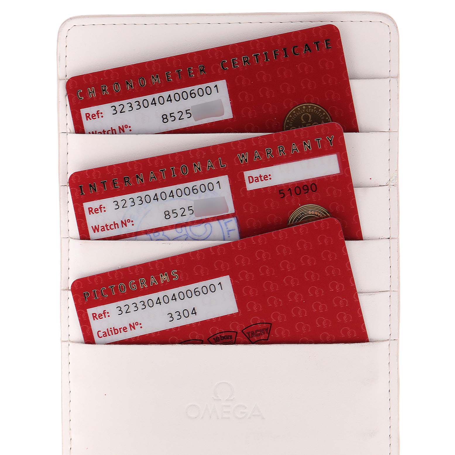 This image shows the warranty and certification cards for an Omega Speedmaster 323.30.40.40.06.001 Men's Stainless Steel Grey Dial 323.30.40.40.06.001 Men's Stainless Steel Grey Dial in a white cardholder.